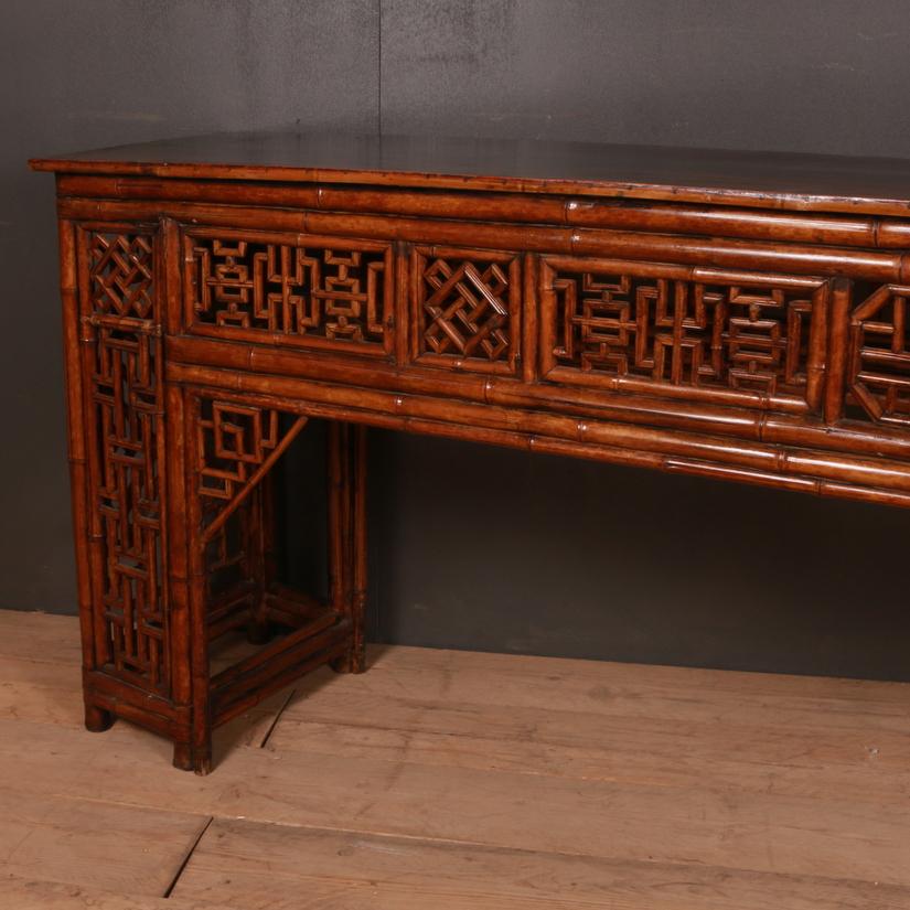 Large 19th century Chinese bamboo console table, 1890.

Dimensions:
101 inches (257 cms) wide
20 inches (51 cms) deep
37.5 inches (95 cms) high.

 