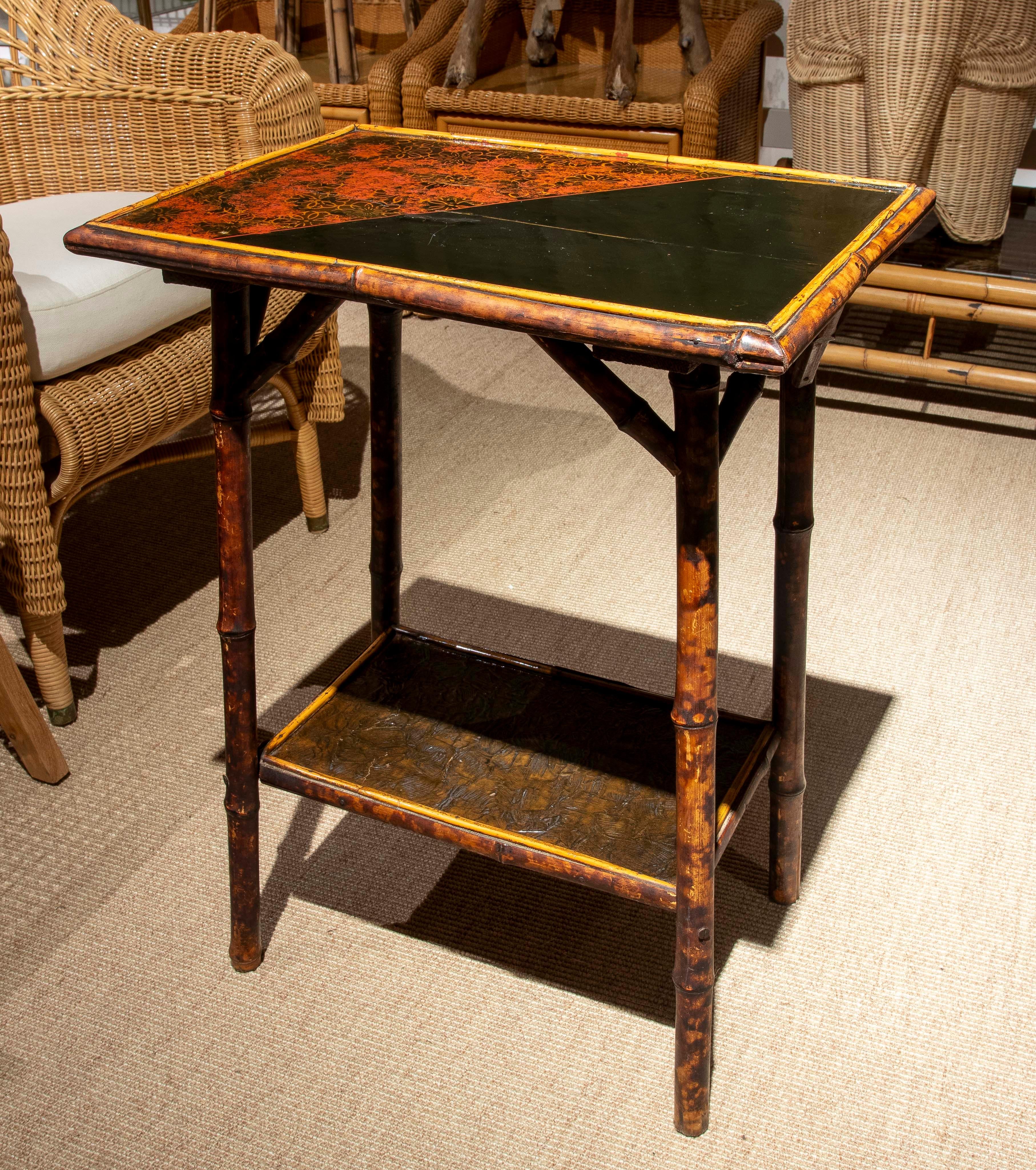 19th Century Chinese Bamboo Side Table with Two Shelves and Black Lacquered Top with Flowers For Sale