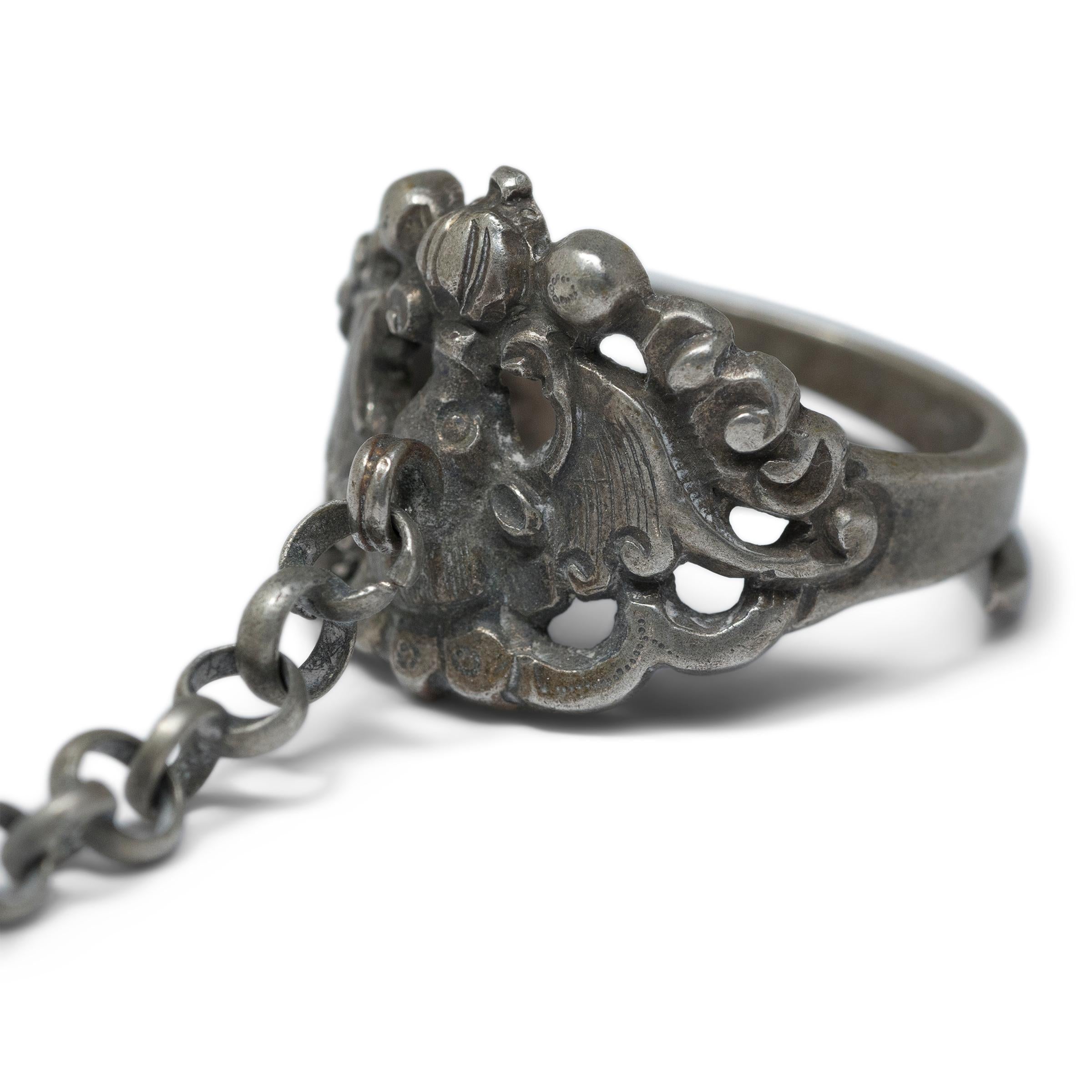 Dated to the late 19th century, this silver charm ring was believed to protect the wearer from bad luck and malevolent spirits. The ring is decorated in relief with a large bat surrounded by swirling clouds. A visual metaphor for the word