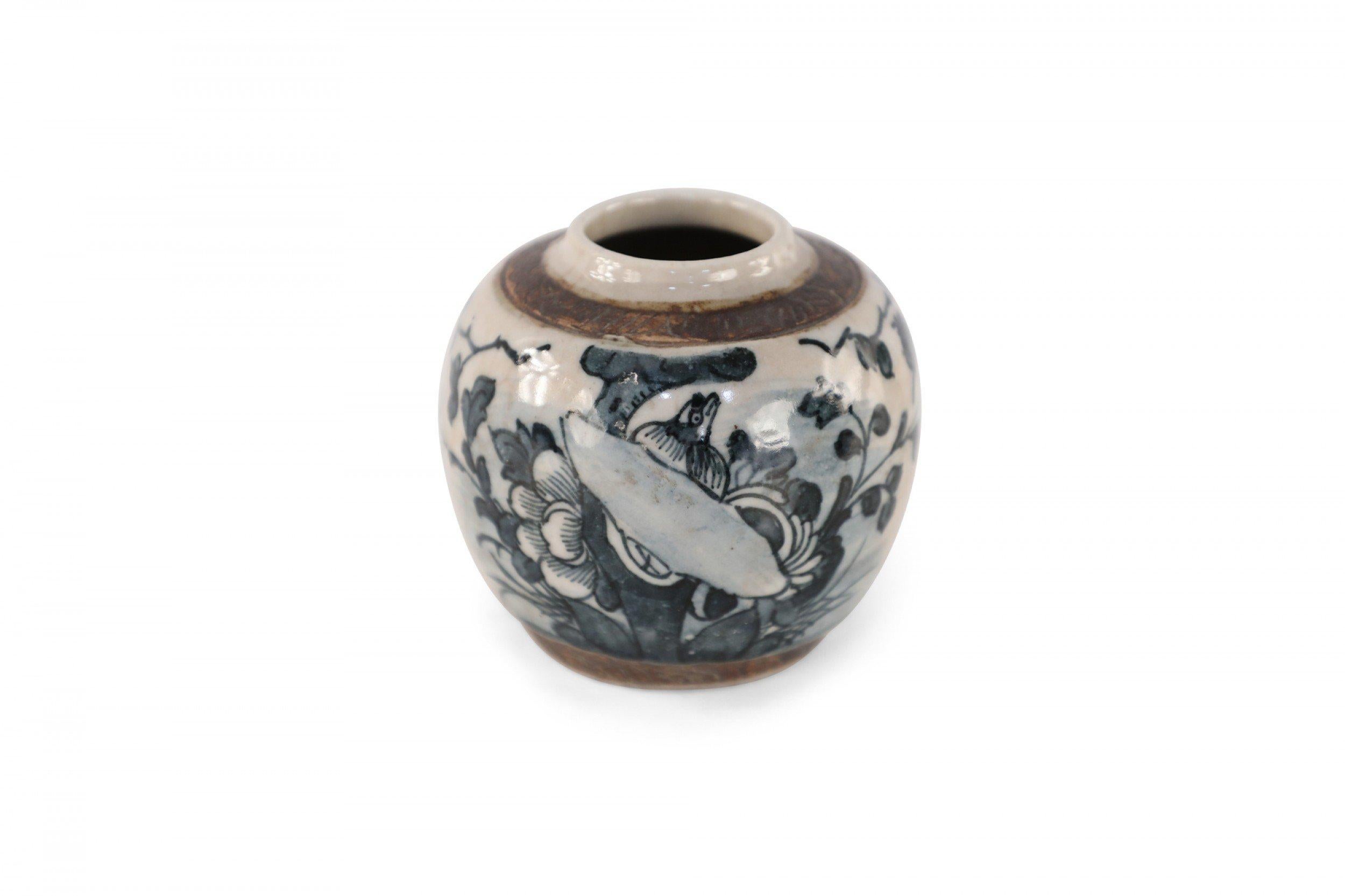 Antique Chinese (early 20th century) small, beige porcelain jar with a slight lip and charcoal-colored florals.
       