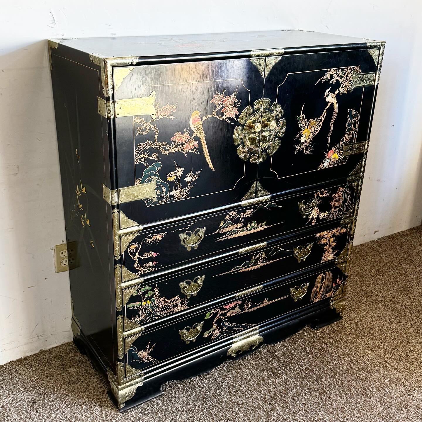 Embrace the elegance of Chinese craftsmanship with this Black and Gold Hand Painted Armoire/Chest of Drawers. Featuring a classic black background with exquisite gold hand-painted motifs, this piece marries functionality with artistry. Ideal for