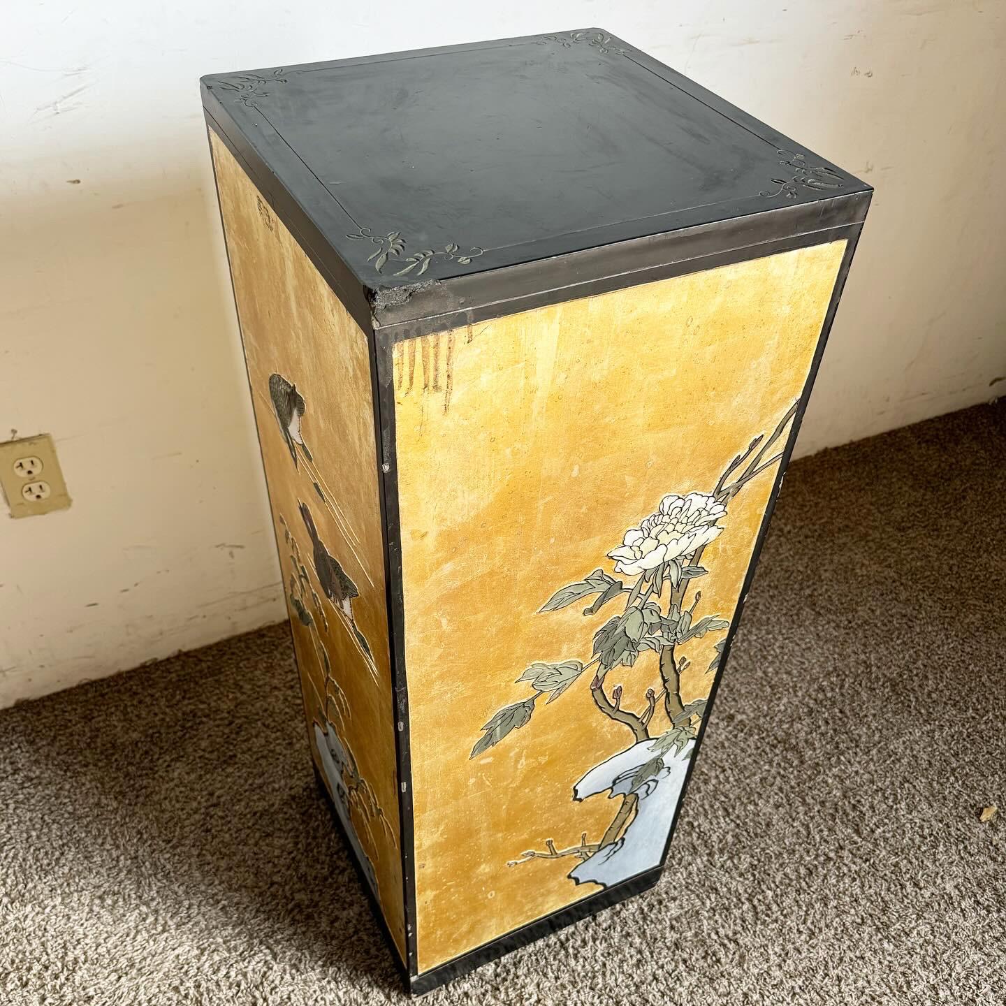 Embrace the elegance of traditional Chinese art with this Black and Gold Hand Painted and Carved Pedestal. Featuring exquisite floral and bird motifs against a gold backdrop, this pedestal is a striking display of craftsmanship. The rich black base
