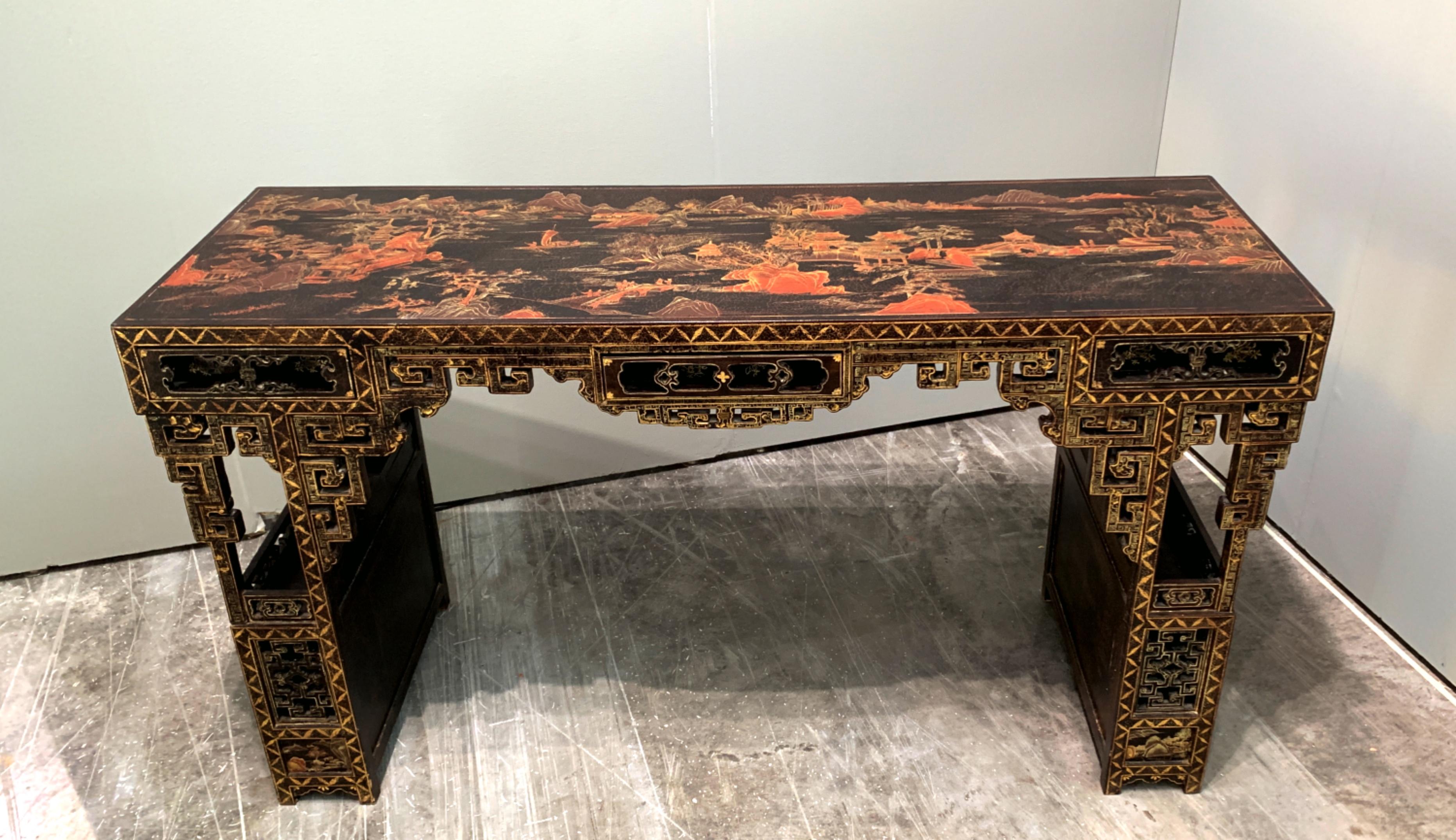 A sumptuously elegant Chinese gilt and red lacquer painted black lacquer console or painting table, Qing Dynasty, late 19th century.

The top of this gorgeous table painted in red lacquer and gilt with a lovely shan shui (mountain and water)