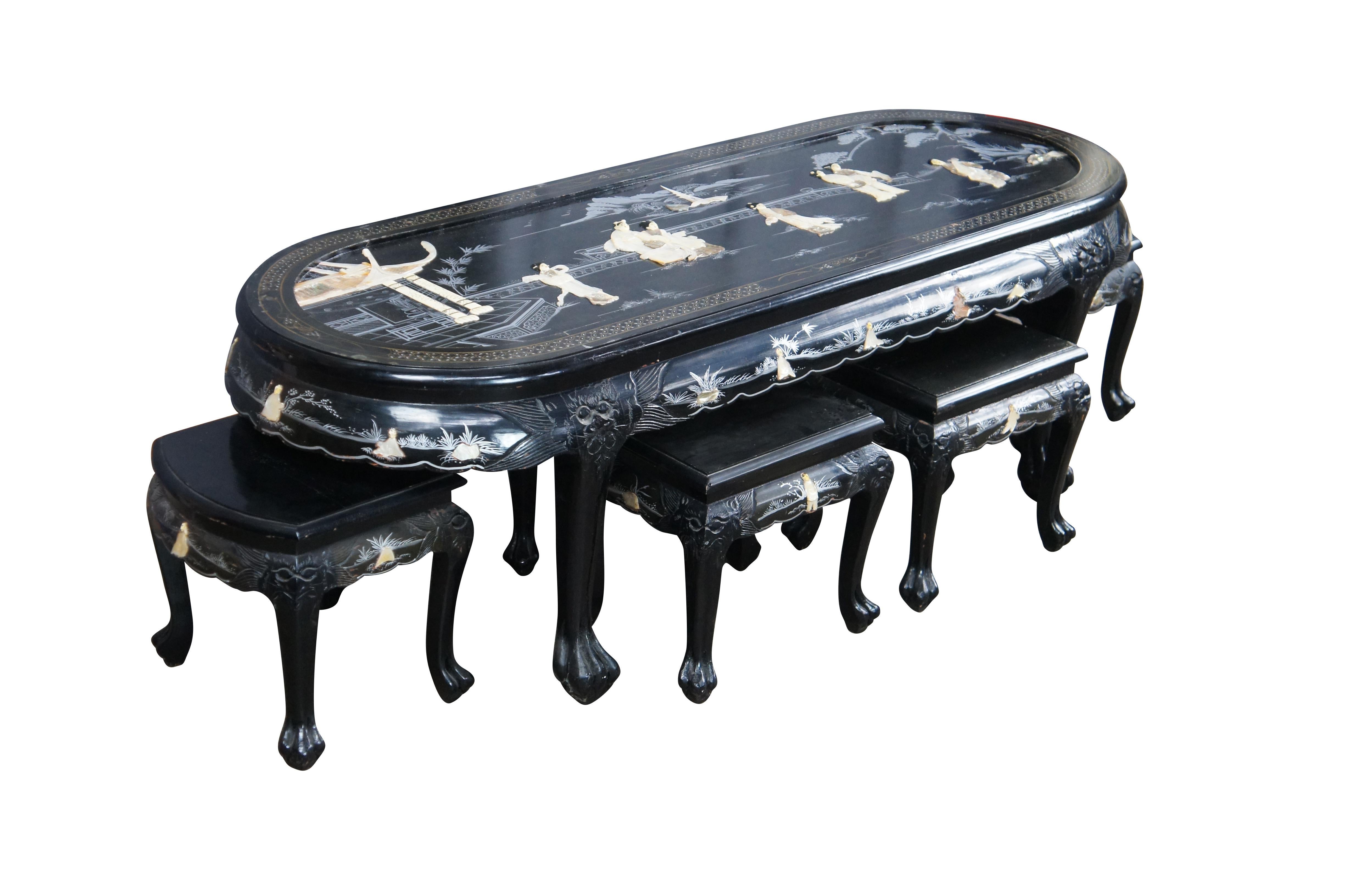 Vintage Chinese Chinoiserie black lacquered coffee or tea nesting table with six chairs.  It features a Pagoda landscape scene with carved soapstone and Mother of Pearl Geisha figures listening to a musician on the garden terrace, which overlooks