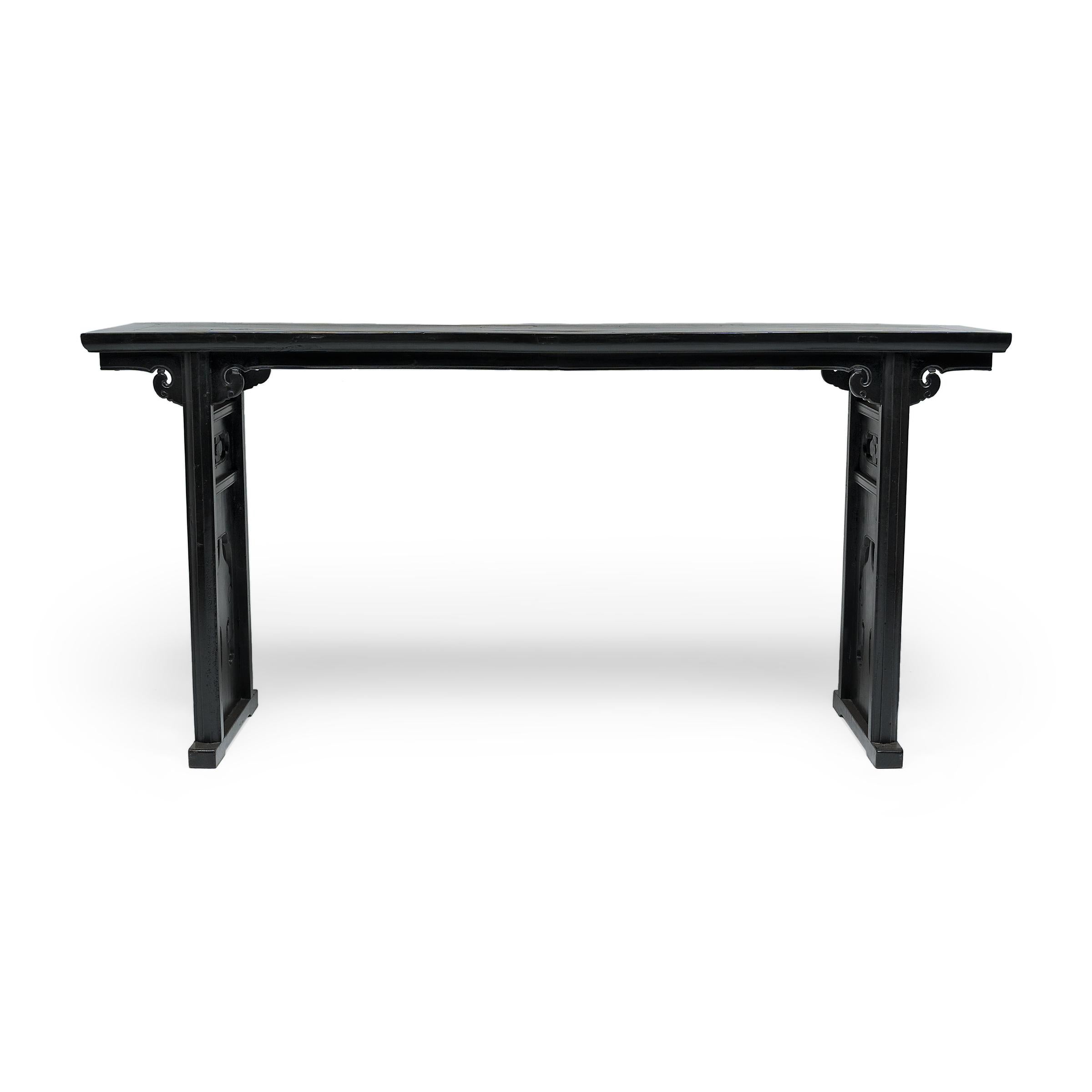 In a traditional Chinese home, long narrow console tables are often placed in the main hall and set with beautiful objects such as instruments, flowers, or porcelains. Referred to as altar tables, these slender tables are also used as a domestic