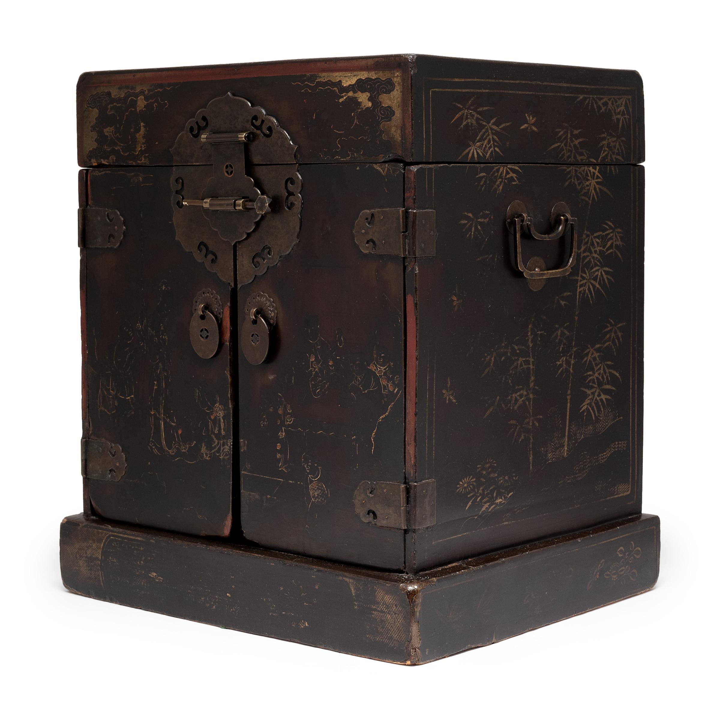 This elegant table chest was once used in the intimate quarters of a Qing-dynasty woman to store her cosmetics, jewelry, and other personal treasures. The wooden box is cloaked in layers of black lacquer, now richly aged and marked by traces of the