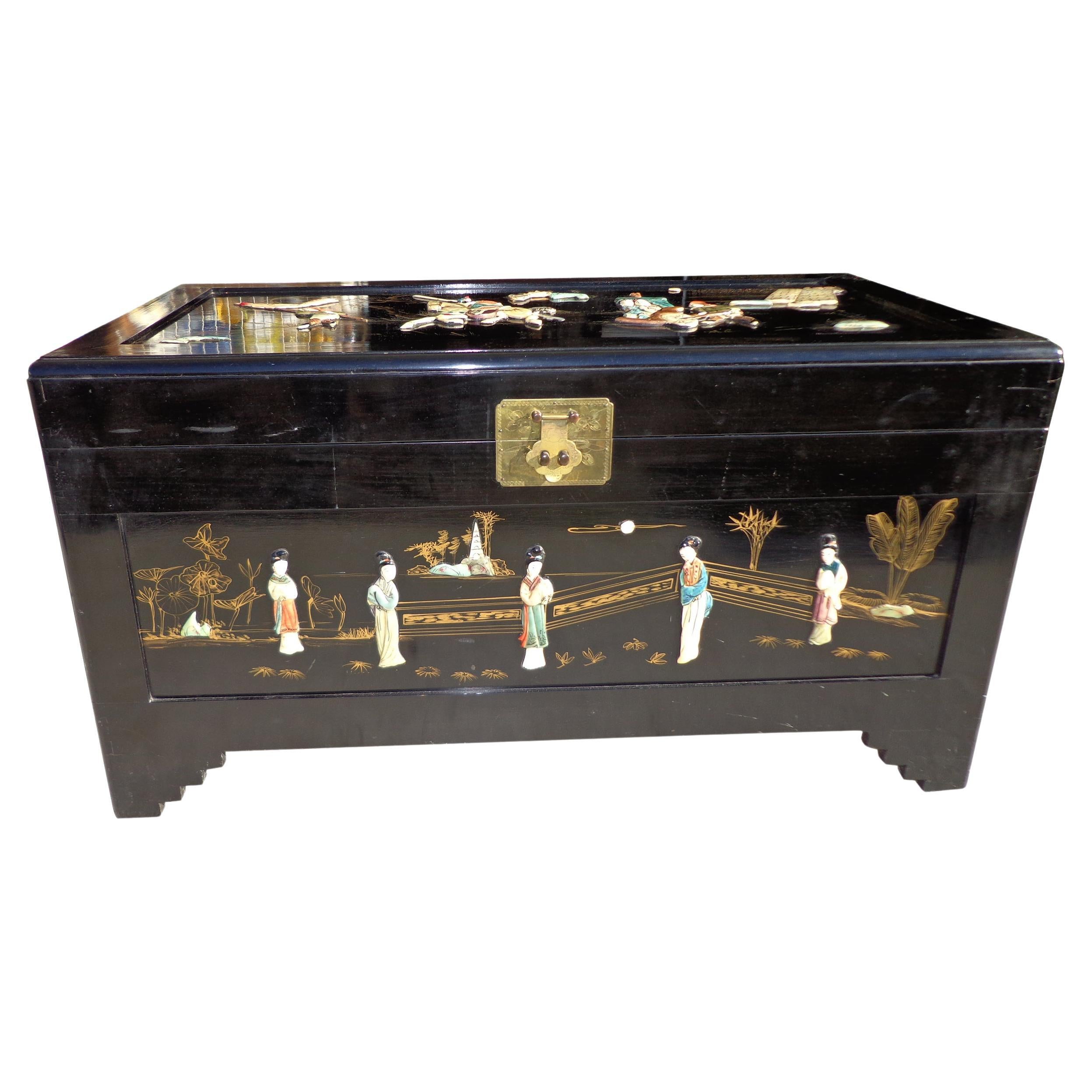 Keep your throw blankets stored neatly inside this late 20th Century wedding chest. The hand painted figural scenes featuring warriors on the top, change on every side with natural elements and floral details added throughout. It is constructed of