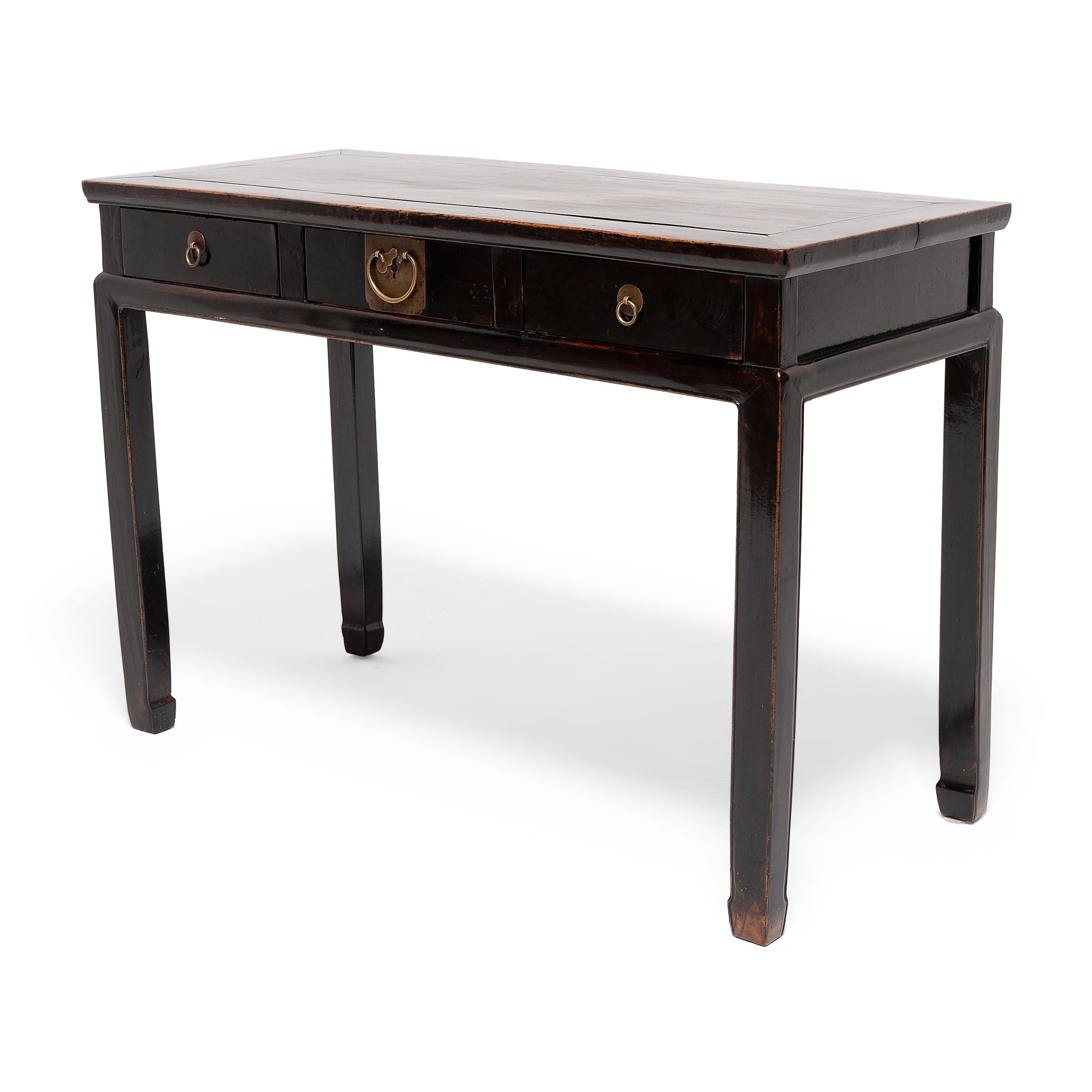 This three-drawer writing desk dates to the mid-19th century and once stood centerpiece in the office of a well-to-do professional of the late Qing-dynasty. Desks with drawers such as this were strongly influenced by Western designs, and didn't