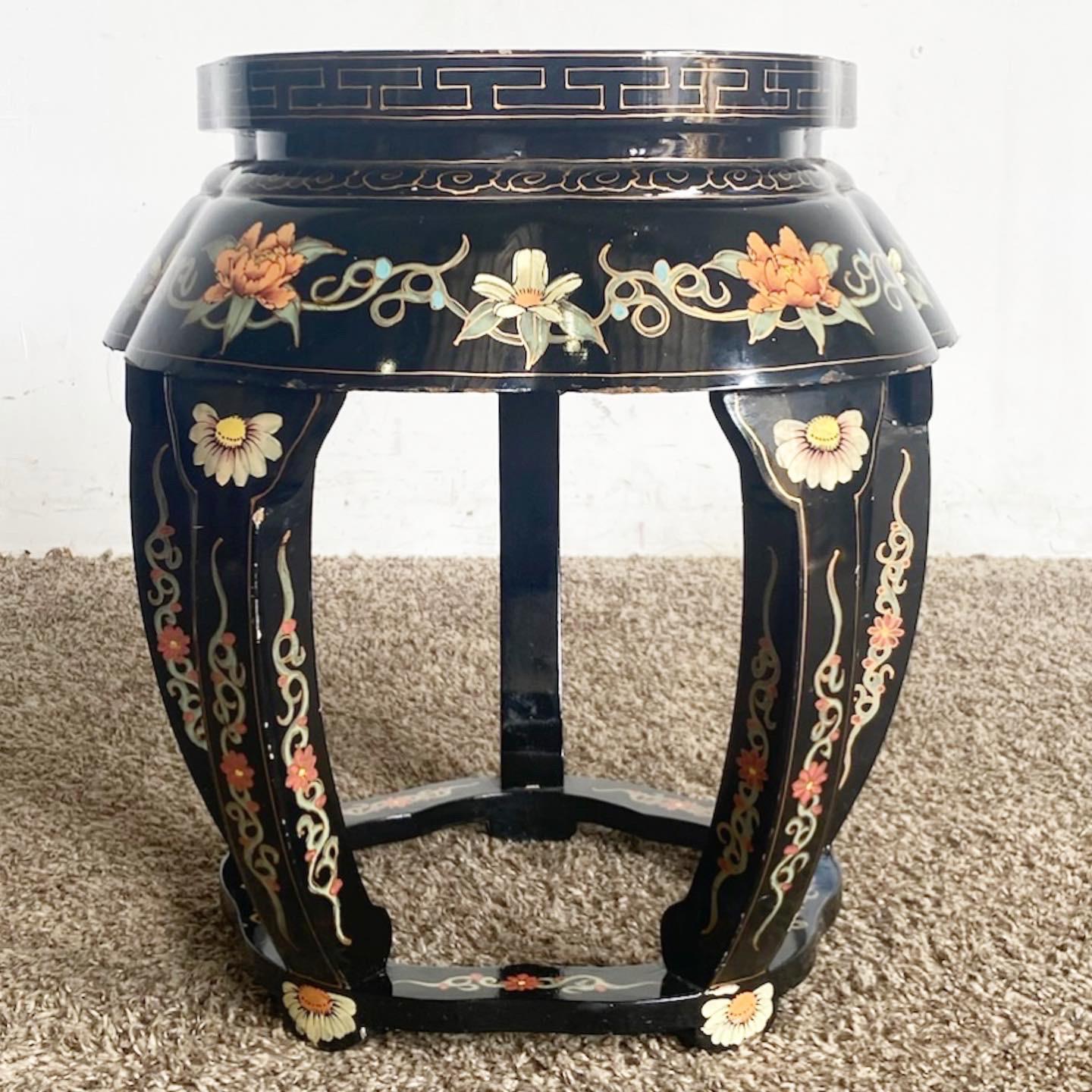 Elevate your interior design with the harmonious fusion of form and function, embodied in this Chinese Black Lacquered Stool/Table. Crafted with meticulous artistry, the luxurious black lacquer intertwines seamlessly with hand-painted details,