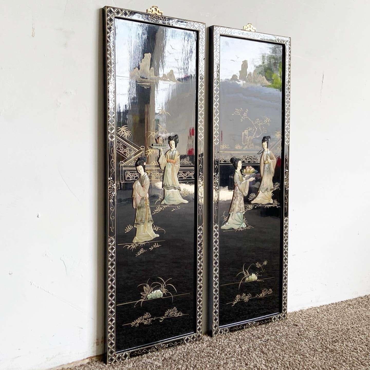 Amazing pair of vintage Chinese black lacquered wall accessories. Each feature a hand painted design with adhere faux stone figures.

