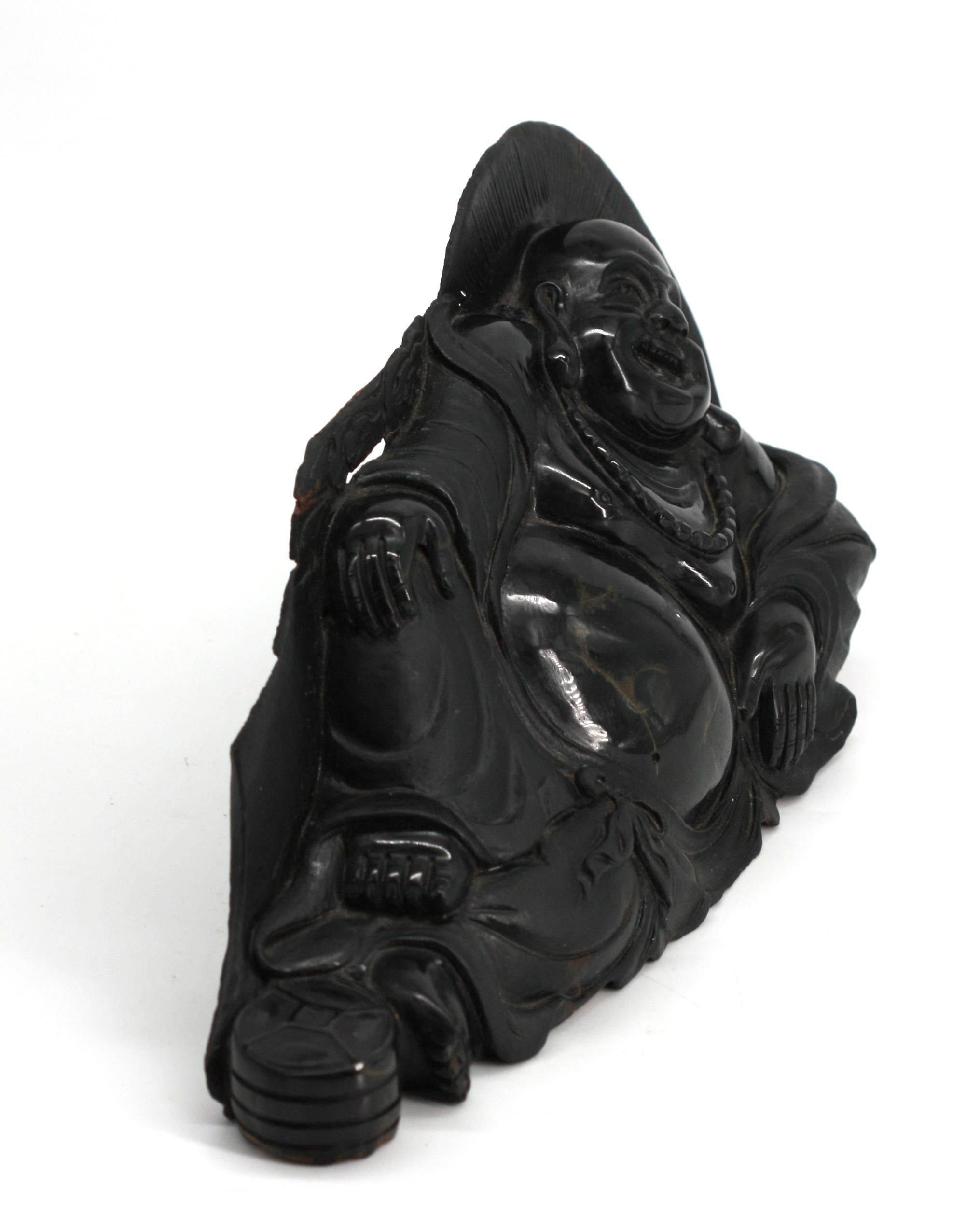 
Chinese Black Stone Reclining Happy Buddha
The scantly clad buddha reclining and wearing a bead necklace.
Height 6 in., Width 12 in., Depth 2.5 in.
Condition Report
Some repairs or adjustments when made to edges.