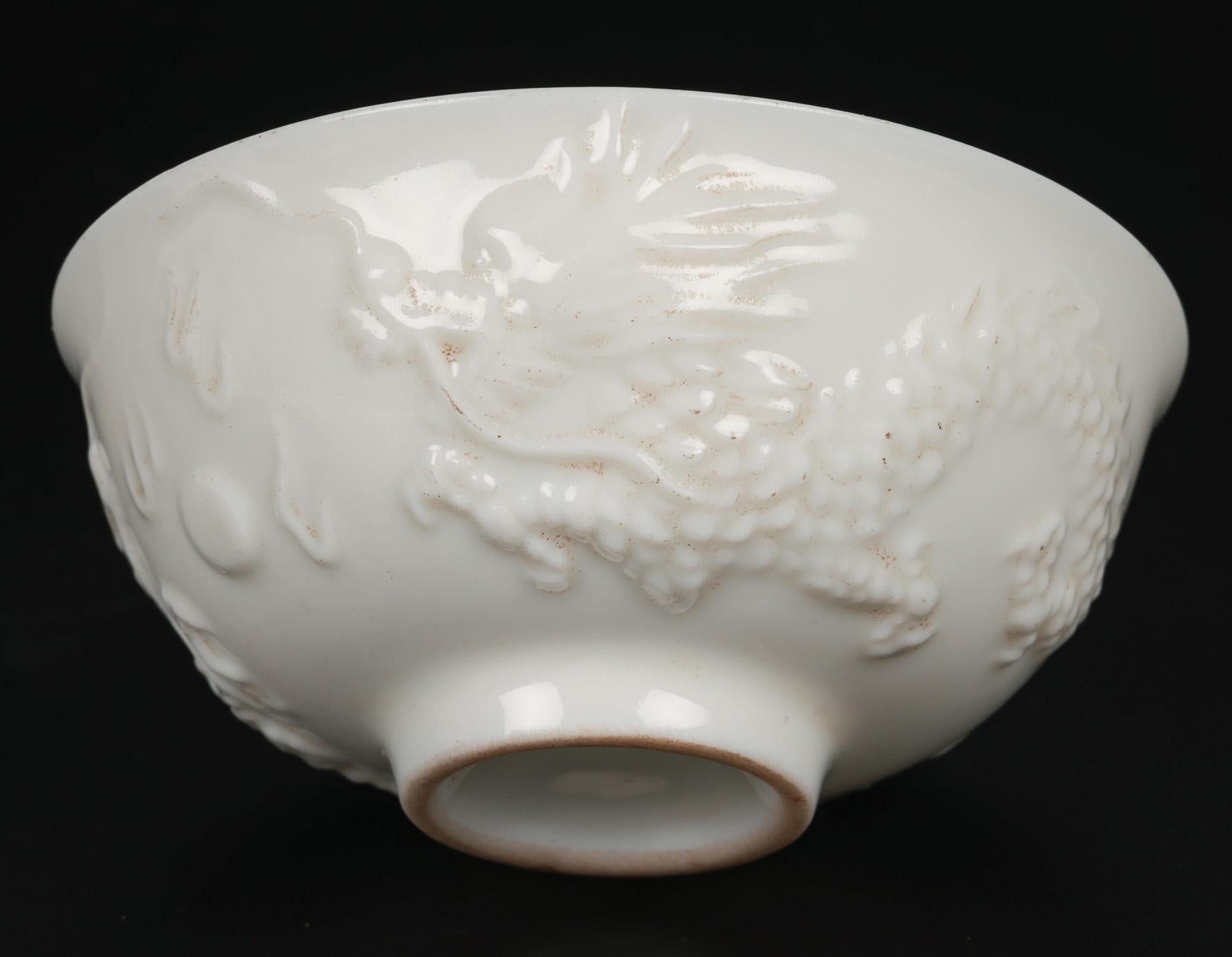 Chinese Blanc de Chine Dueling Dragon Molded Tea Bowls In Good Condition For Sale In Bishop's Stortford, Hertfordshire