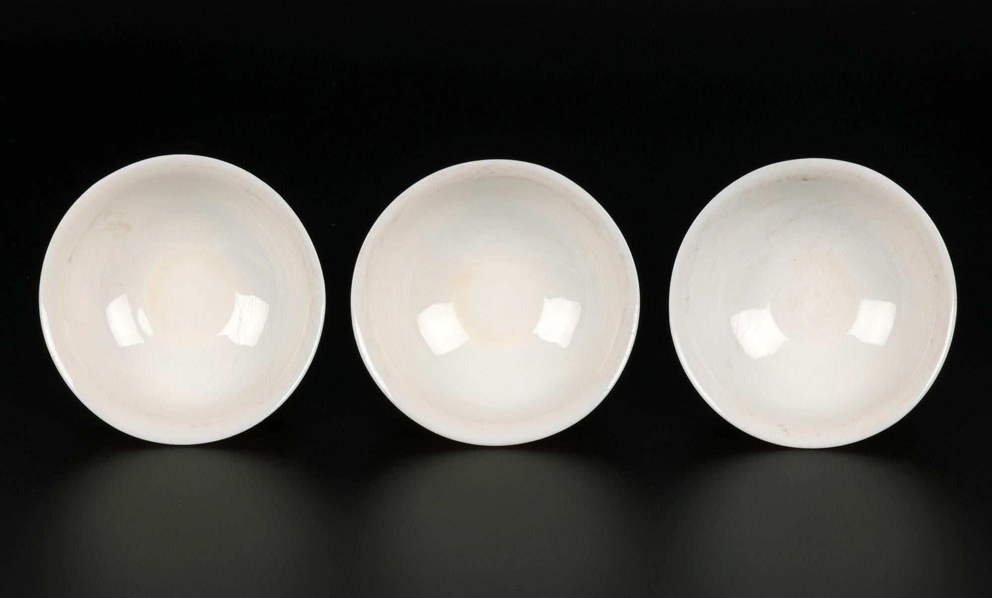 Porcelain Chinese Blanc de Chine Dueling Dragon Molded Tea Bowls For Sale
