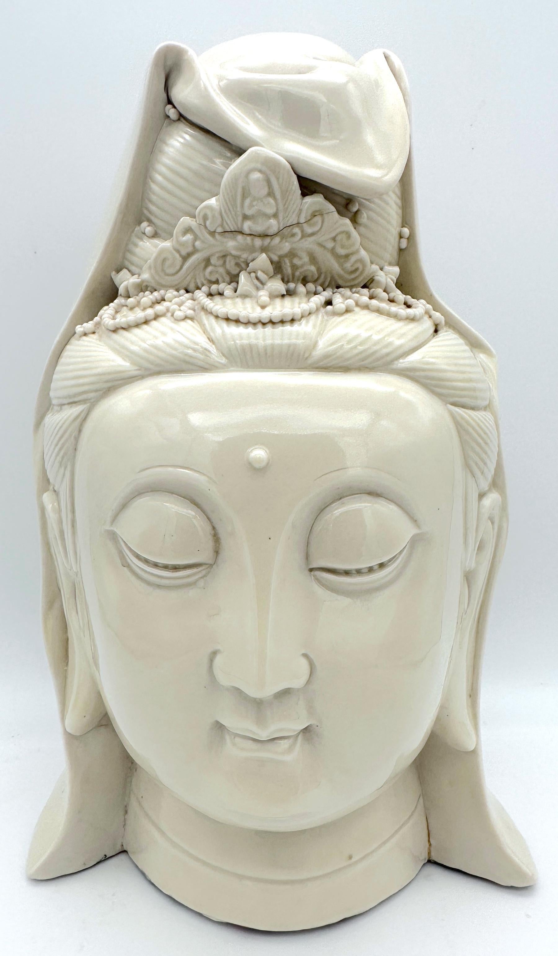Chinese Blanc De Chine Head of Buddha
China 20th Century

A fine Chinese Blanc De Chine Head of Buddha from the 20th century. This finely made piece stands at 10 inches in height, showcasing a highly detailed portrait bust of Buddha. The serene