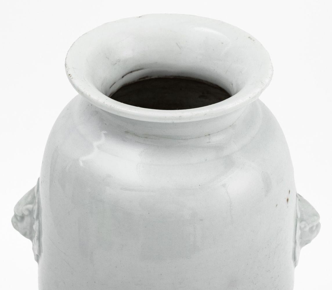 Chinese Blanc de Chine Porcelain Sleeve Vase, 18th century, with two mask form handles. 10.25