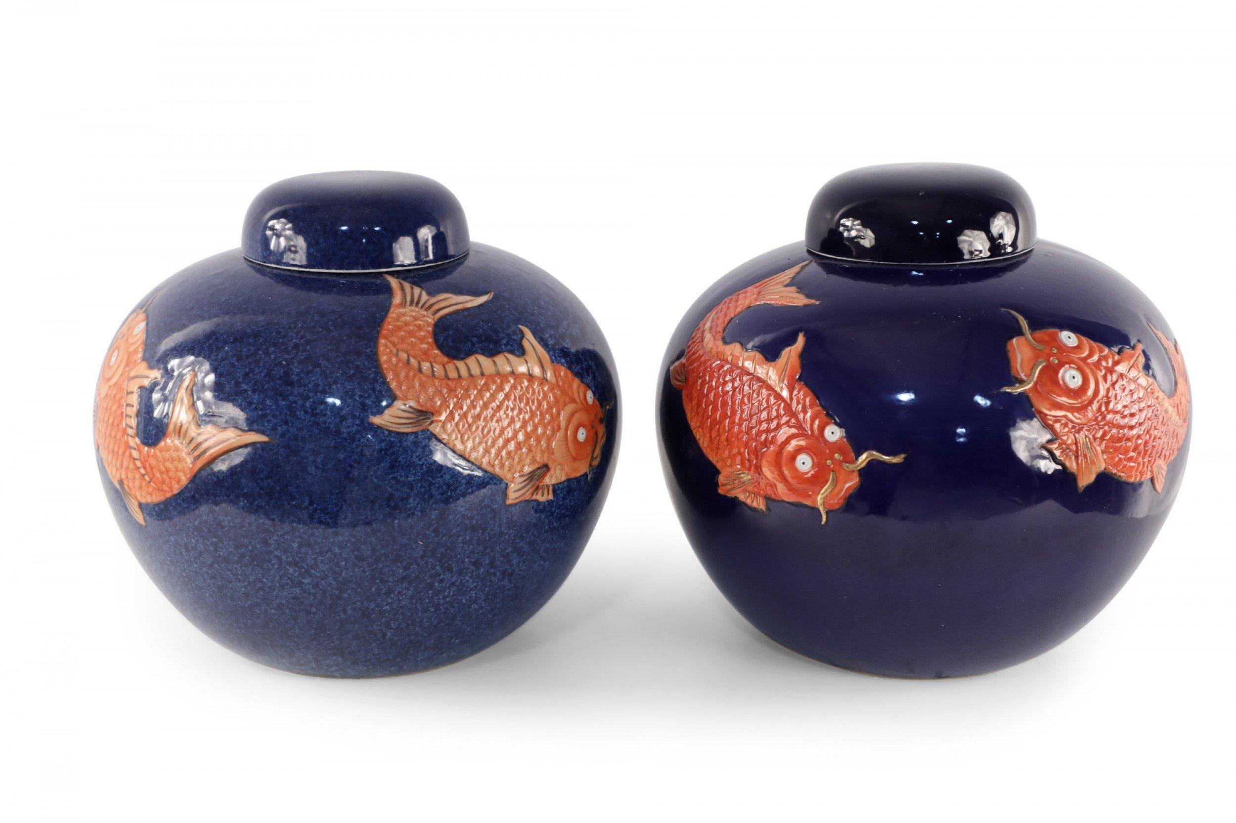 4 antique Chinese (Mid 20th Century) similar porcelain vases with orange fish swimming around blue backgrounds - some displaying sponged effects - inspired by patterns from the Ming Dynasty (vases vary in shape, size and pattern) (Priced Each).
  