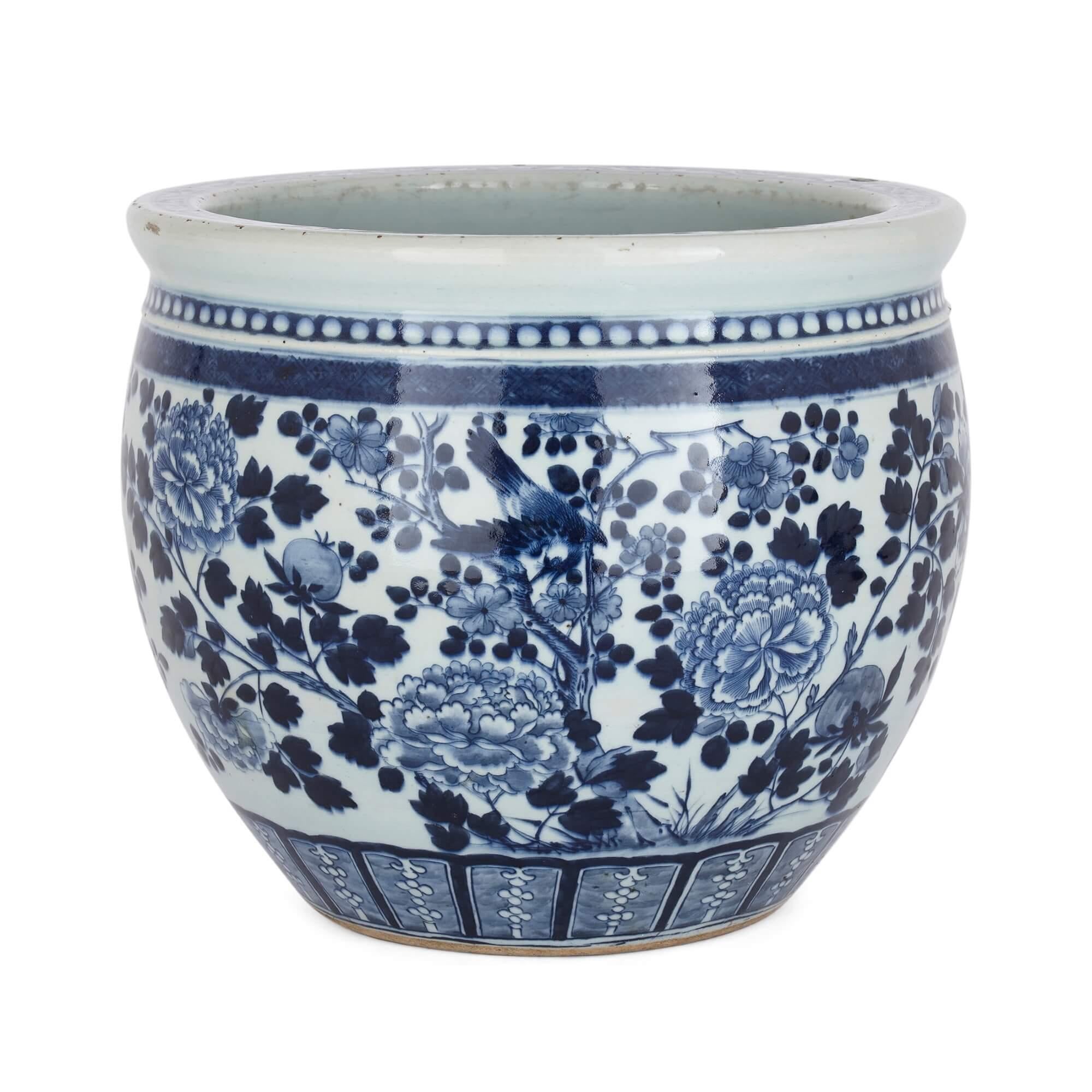 Chinese blue and white antique ceramic jardiniere with floral designs
Chinese, Early 20th Century
Height 31cm, diameter 37cm

This charming Chinese antique ceramic jardiniere features nature-inspired patterns. Blossom trees, flowers and birds