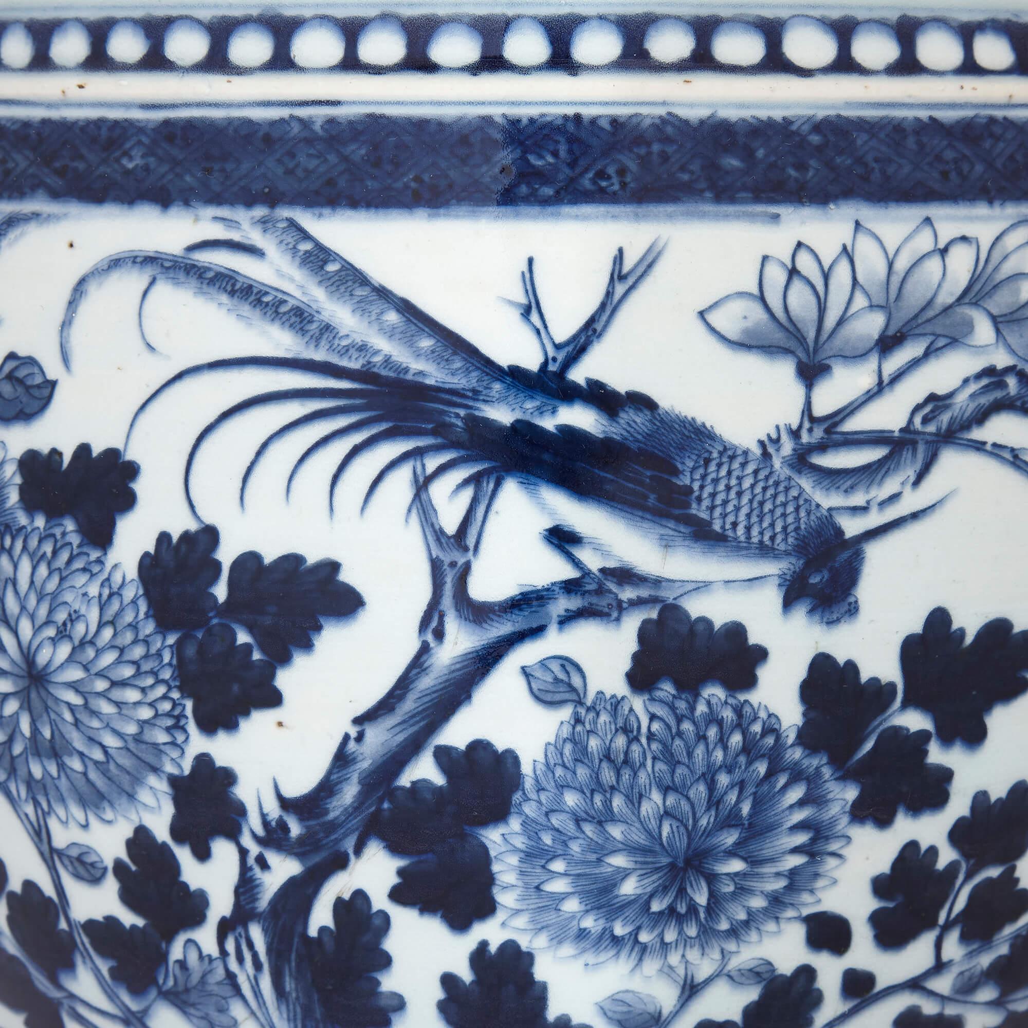 Qing Chinese Blue and White Antique Ceramic Jardiniere with Floral Designs For Sale