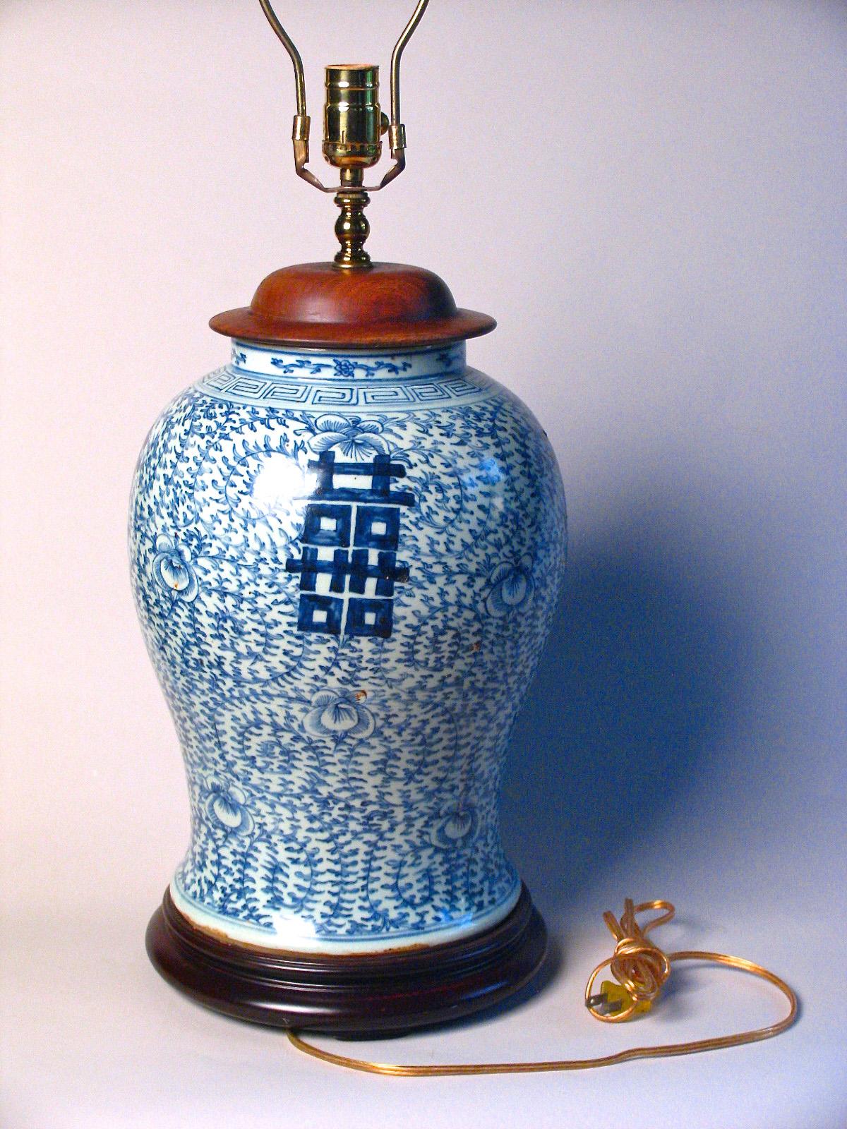 Chinese blue and white baluster vase fitted as a lamp. Ceramic vase with a cobalt blue underglaze design of convolvulus bindweed, a symbol of love and marriage, with four bold hei (double happiness) characters, with key-fret pattern at the