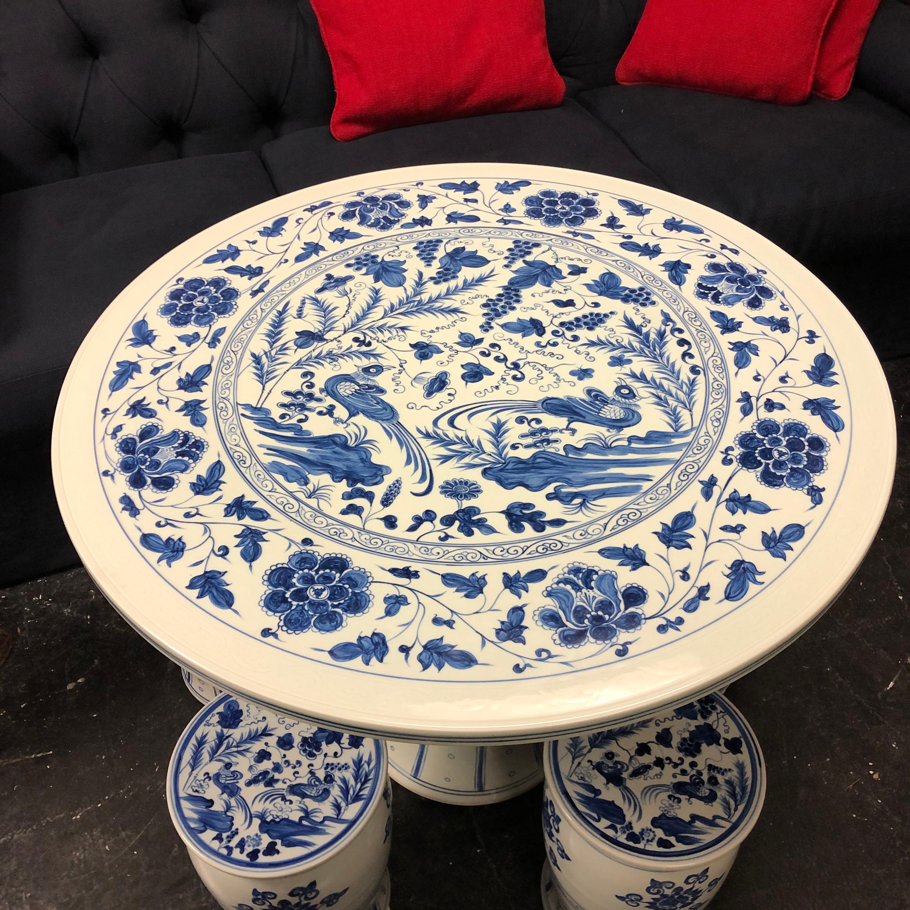 Chinese blue and white cafe table and four stools

Measures: Table 27.25