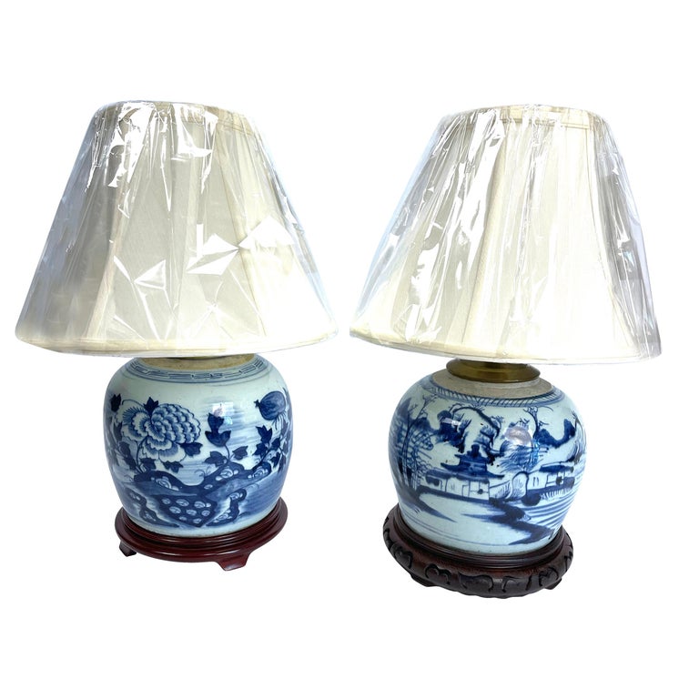 Chinese blue and white canton ginger jars made into lamps with new bases and new matching bell-shaped white shades, They measure 15 