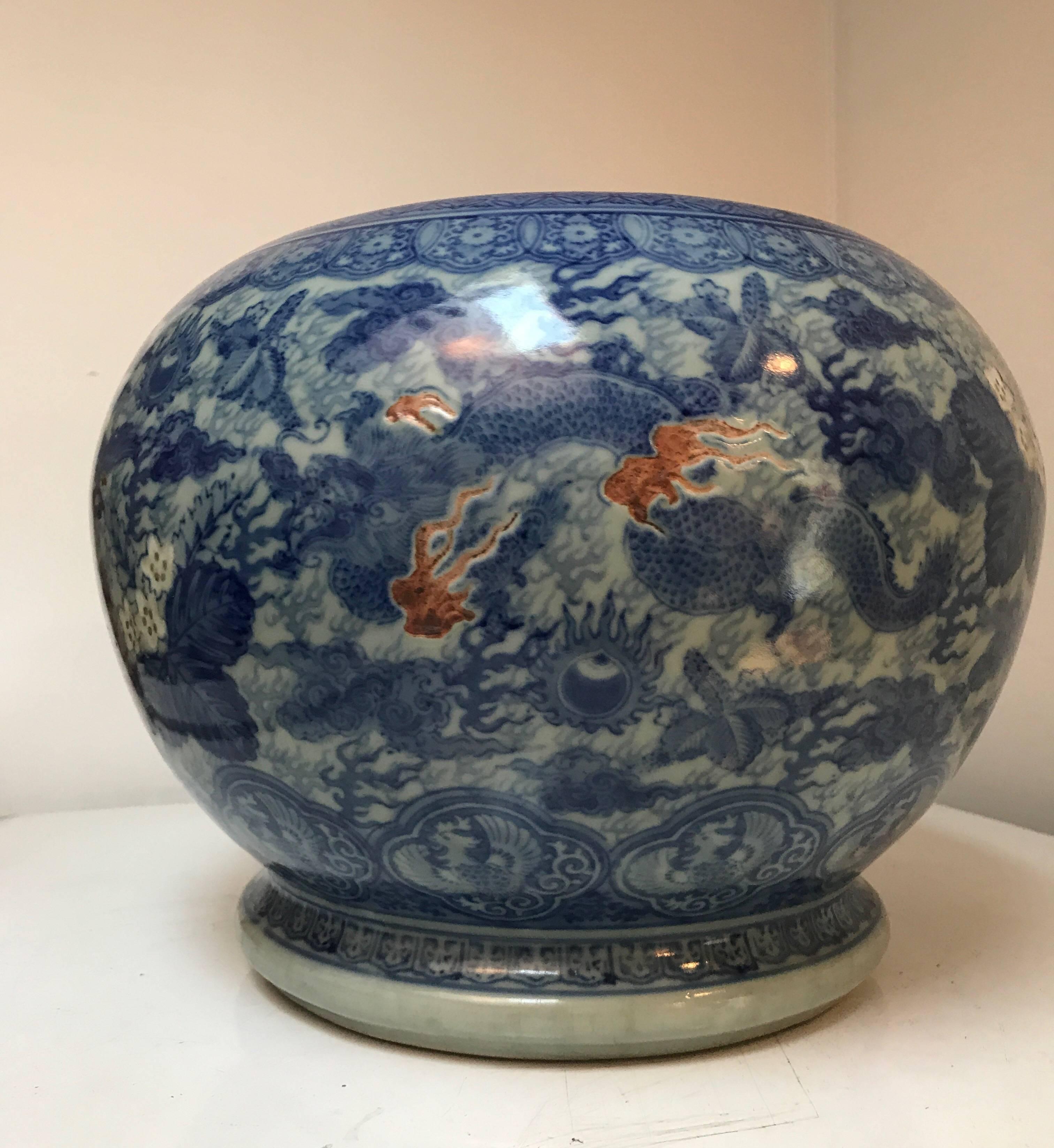 A brightly colored blue and white Japanese ceramic fishbowl planter jardinière cachepot.
The planter is finely decorated with Classic Japanese floral and geometric motives.
Great indoors or outdoors.