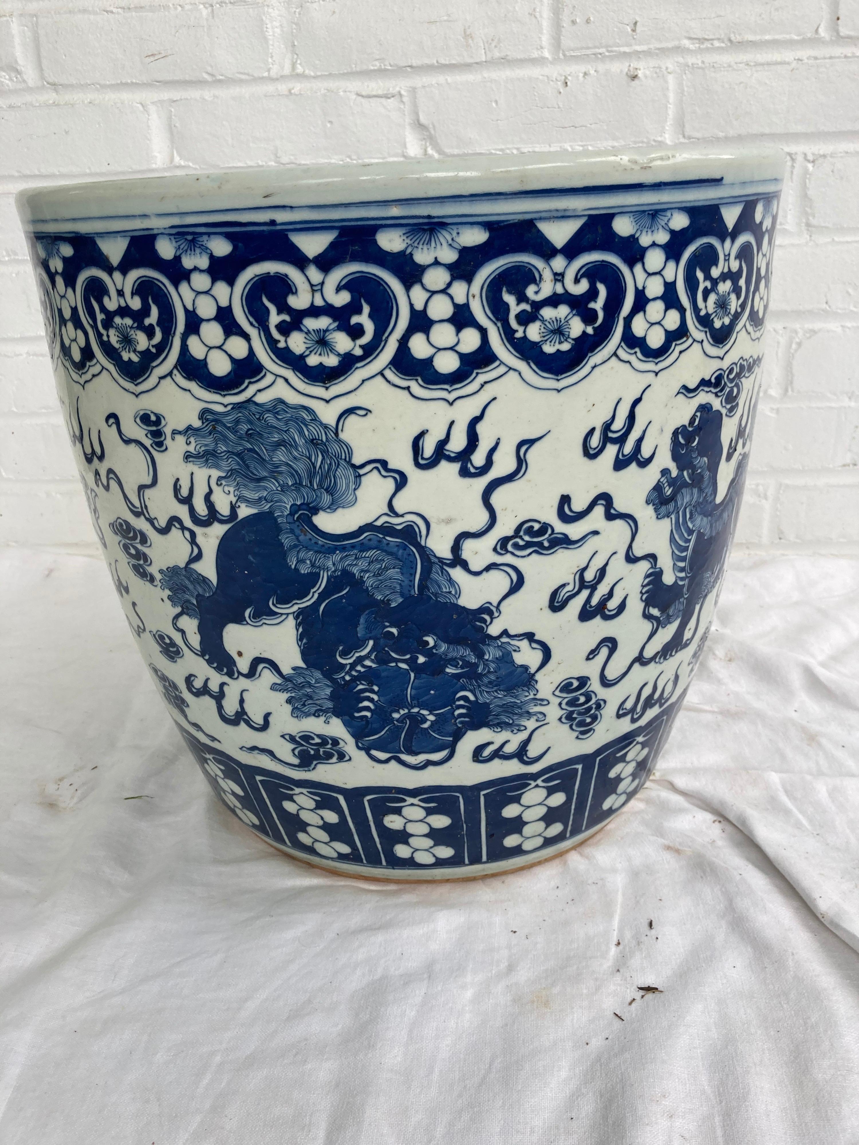 Beautiful Chinese blue and white planter decorated with dragons and drilled hole for drainage...