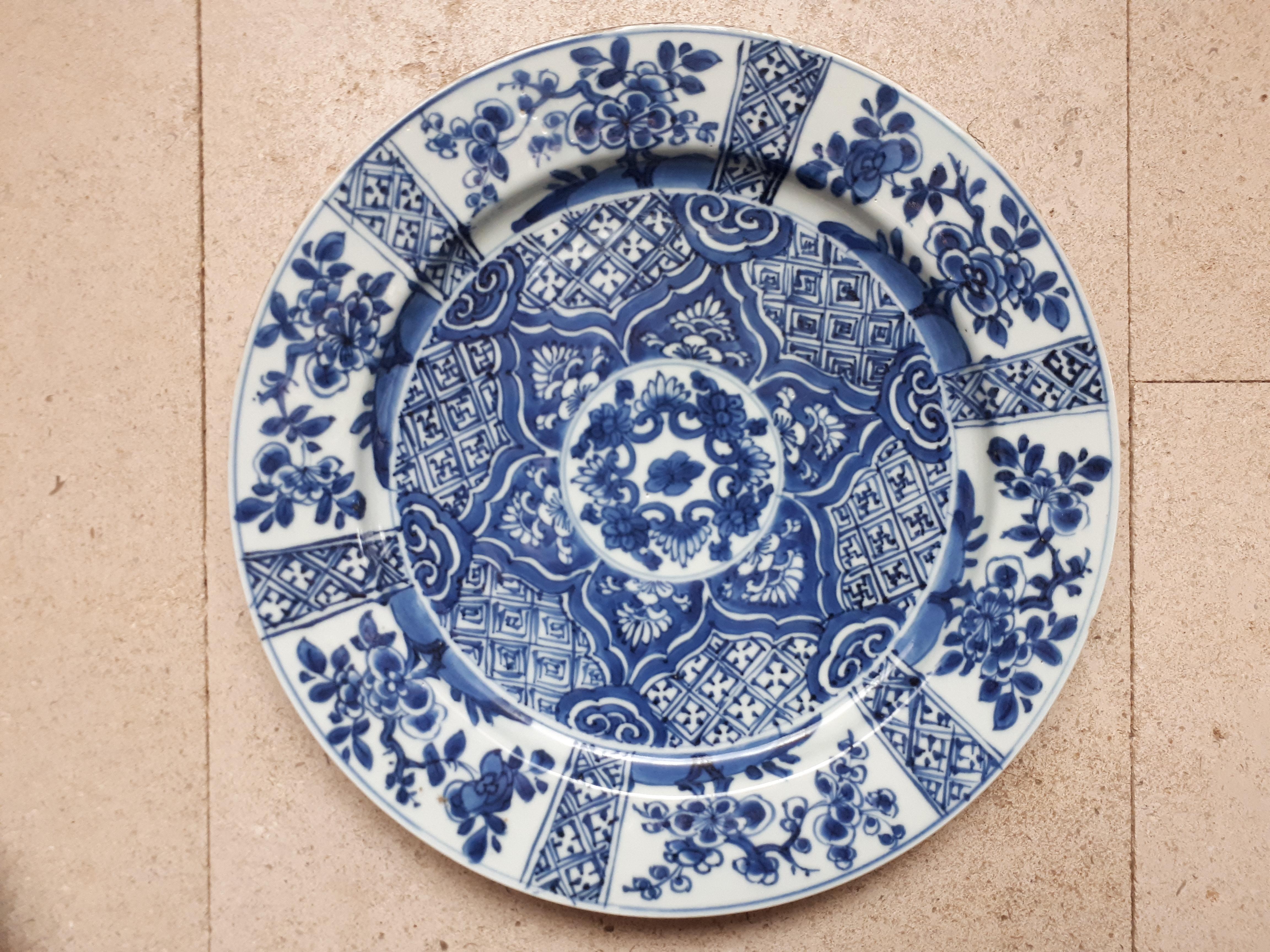Small porcelain dish with blue decoration undercover of floral motif and lingzhis on geometric background, the wing decorated with prunus branches in reserves. Tiny chips on the border, otherwise superb condition !
China, 18th century.