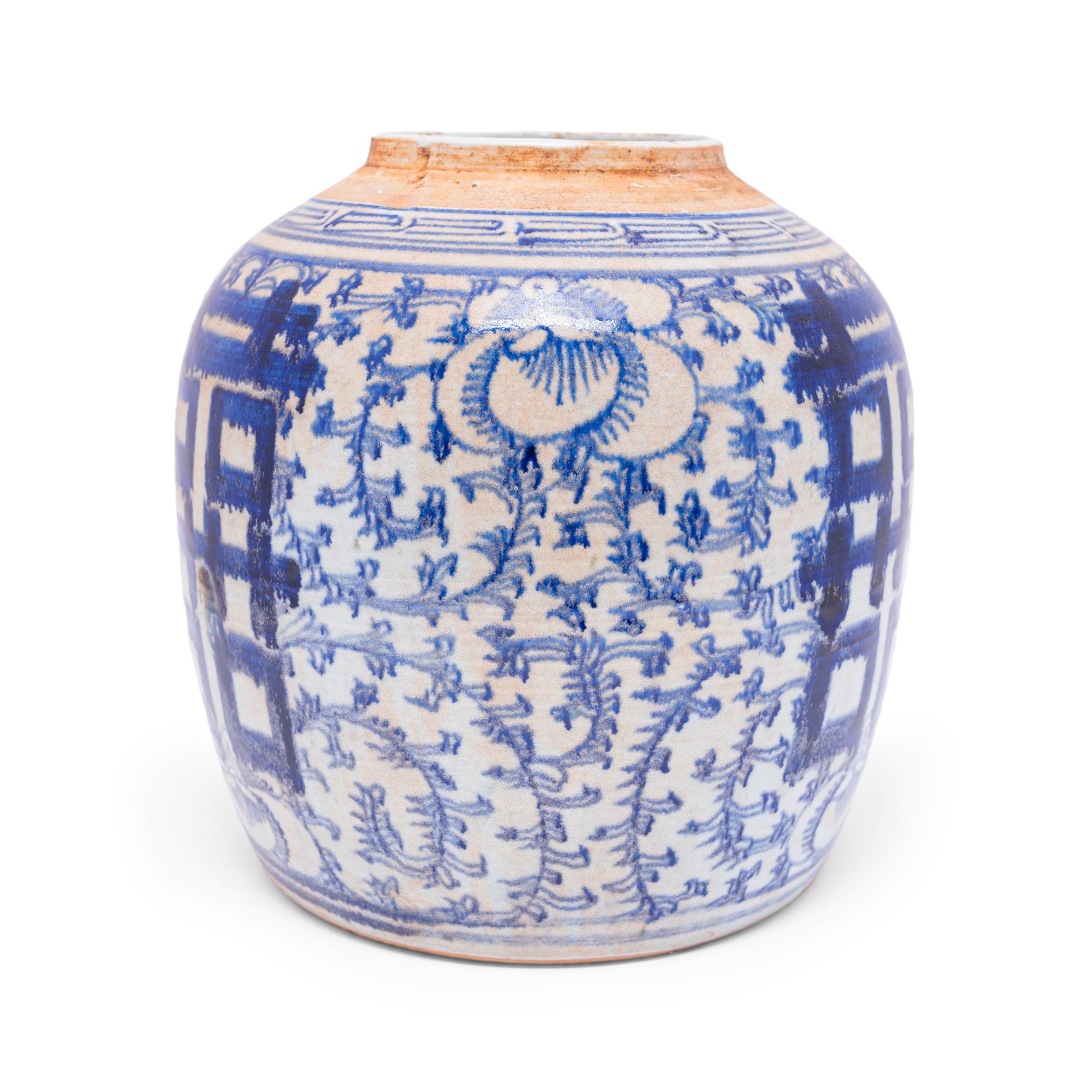 Glazed in the classic blue-and-white manner, this rounded jar offers a blessing of happiness and good fortune. Painted on either side of the jar is the ? symbol for 