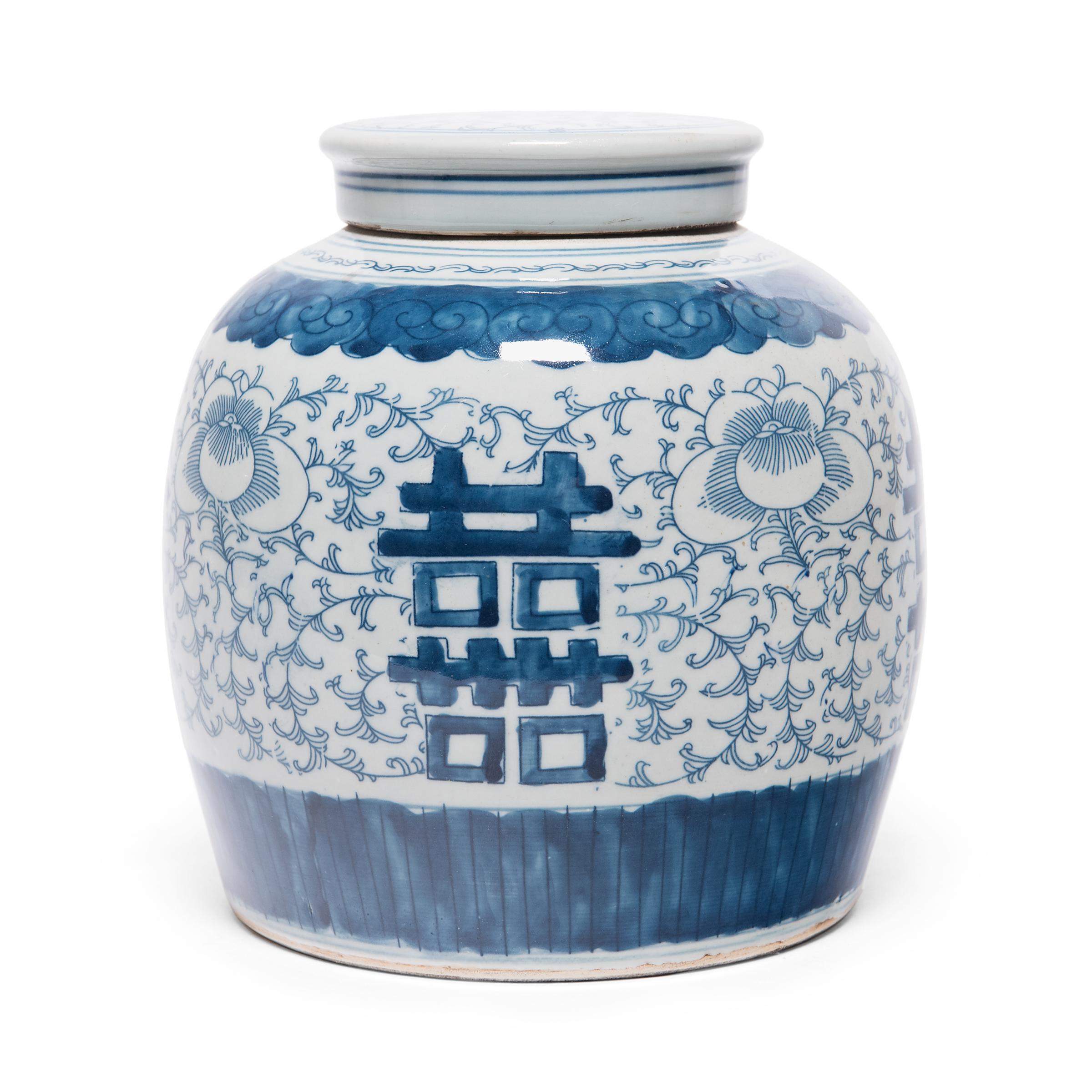 Glazed in the classic blue-and-white manner, this rounded jar offers a blessing of happiness and good fortune. Painted on either side of the jar is the? symbol for 
