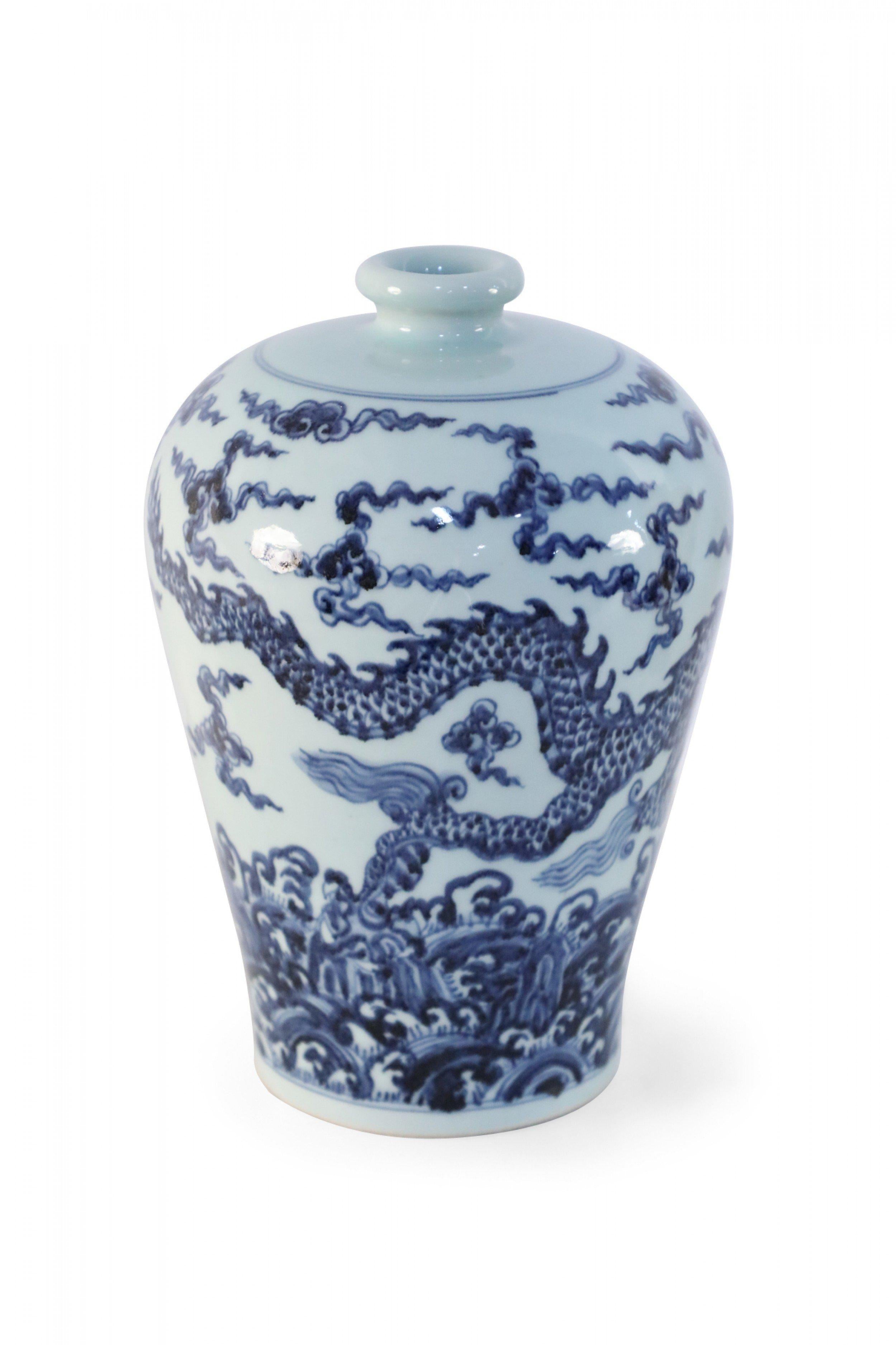 Antique Chinese (Late 17th Century-style) white porcelain Meiping vase decorated in a swirling blue dragon motif.
 