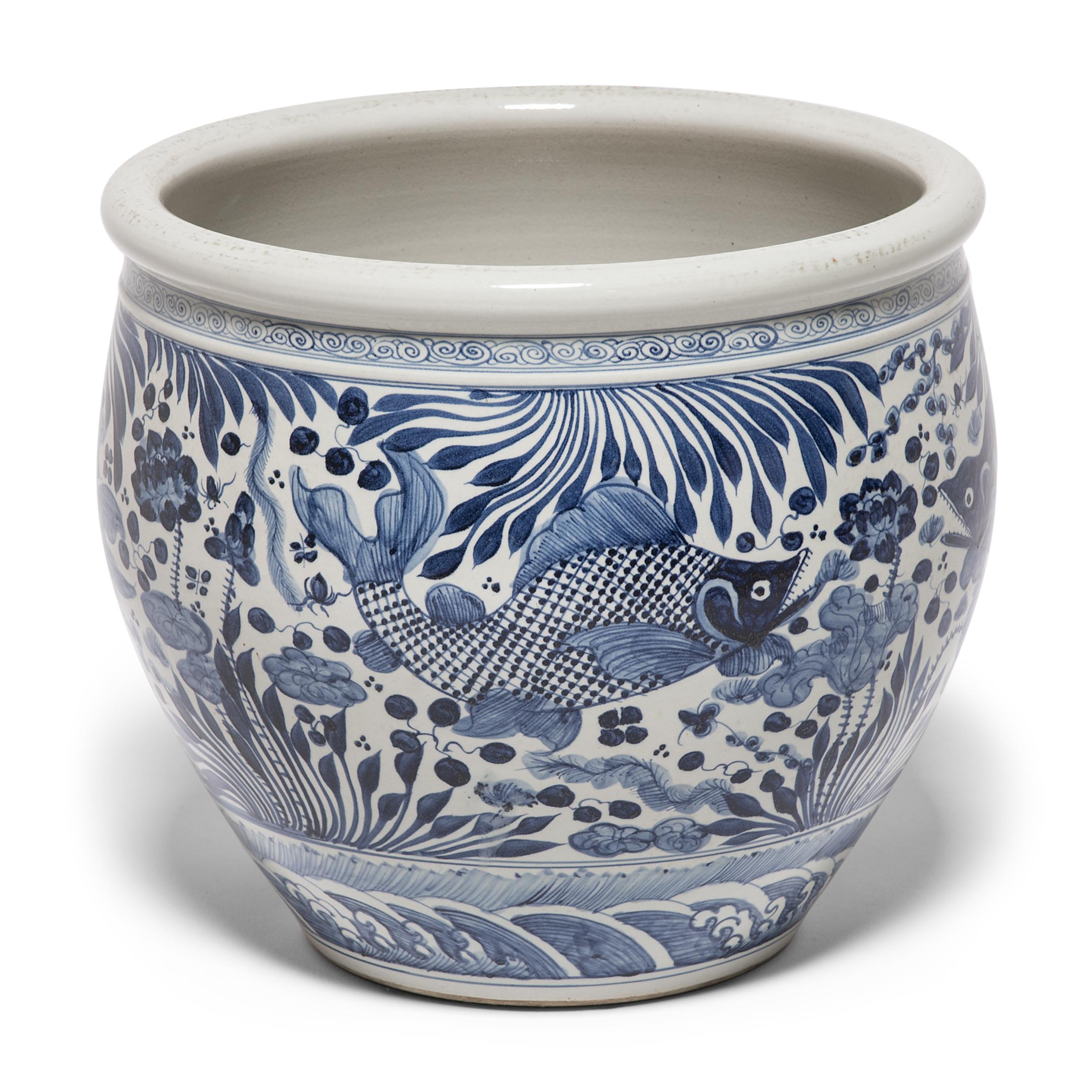 blue and white fish bowl planter