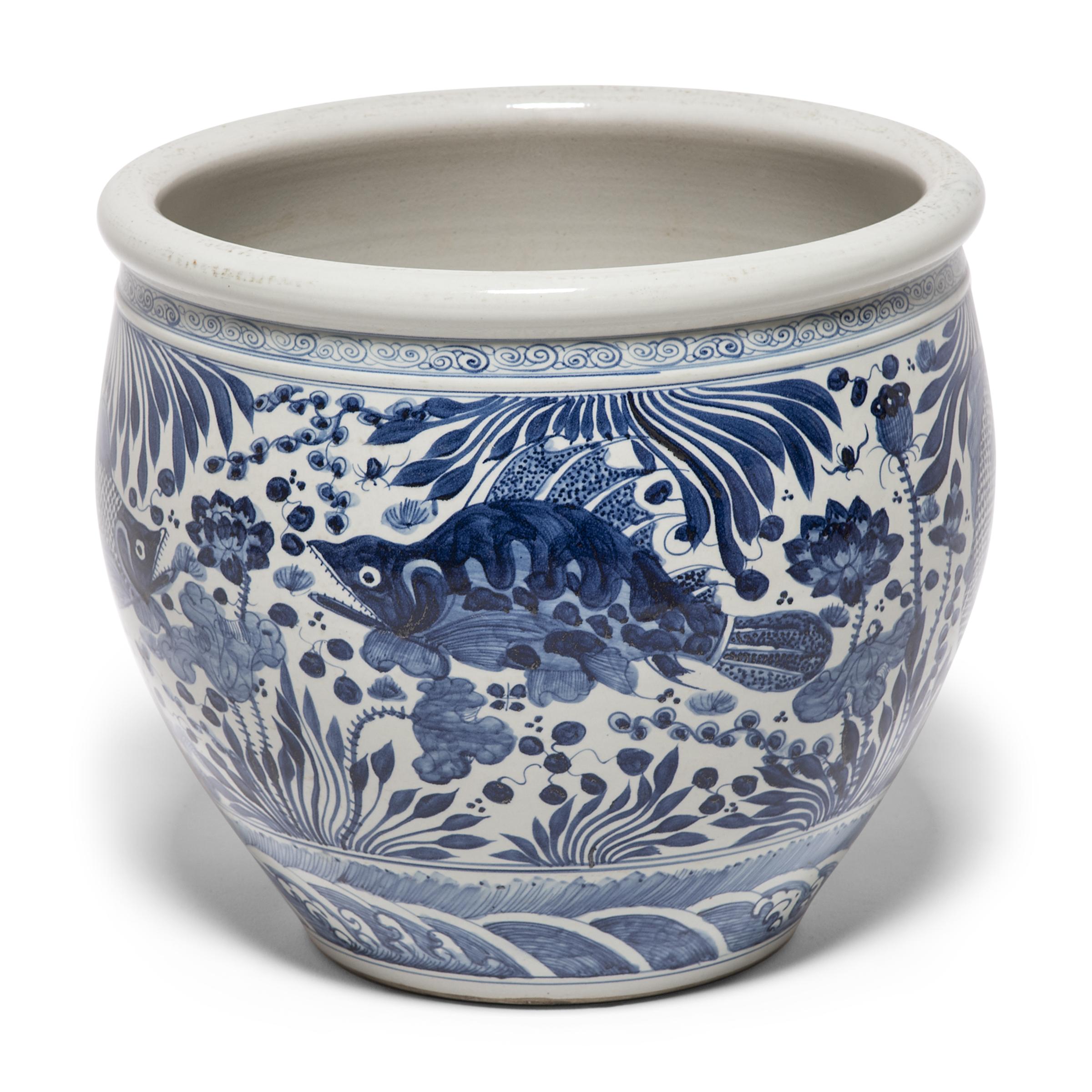blue and white fishbowl planter