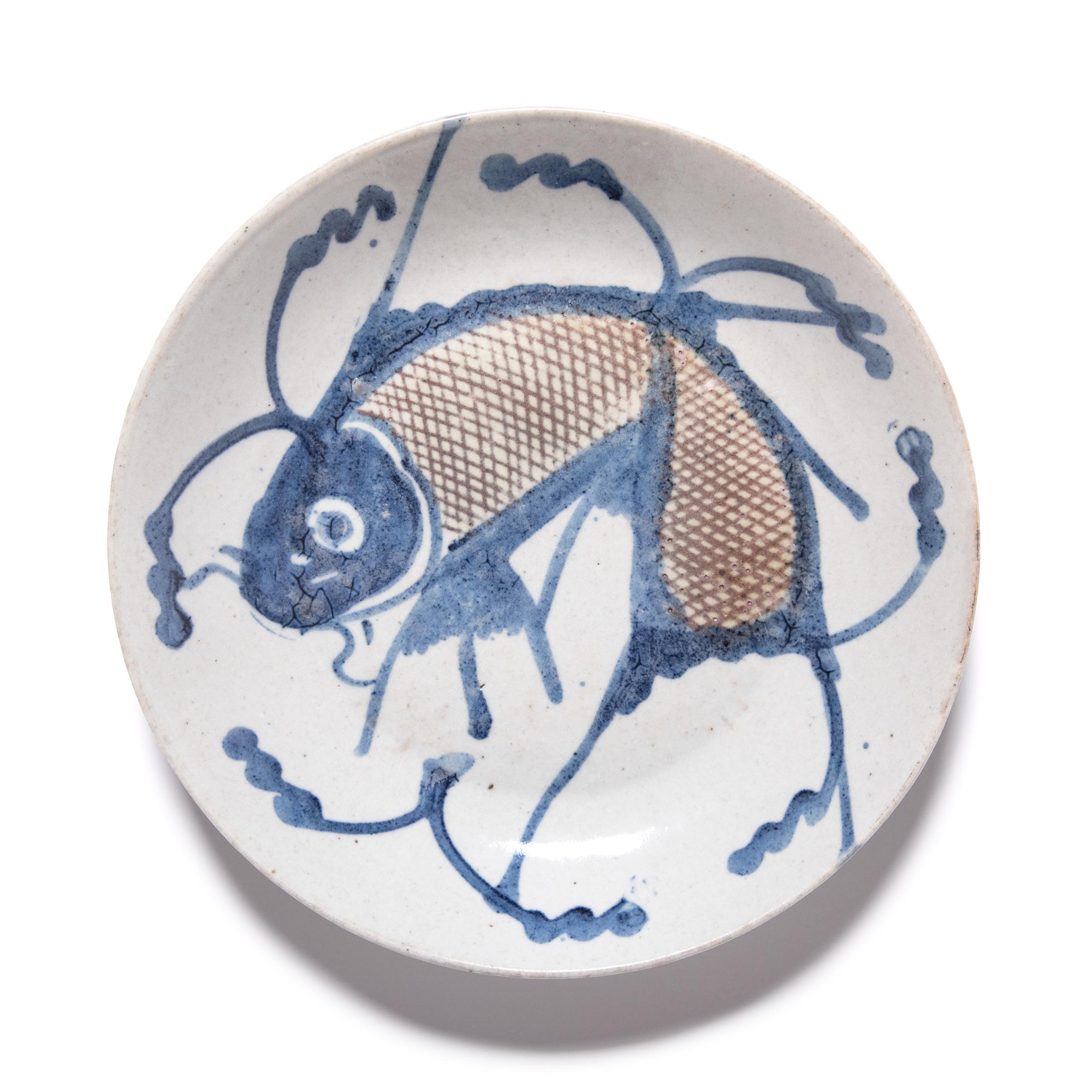 blue and white fish plates