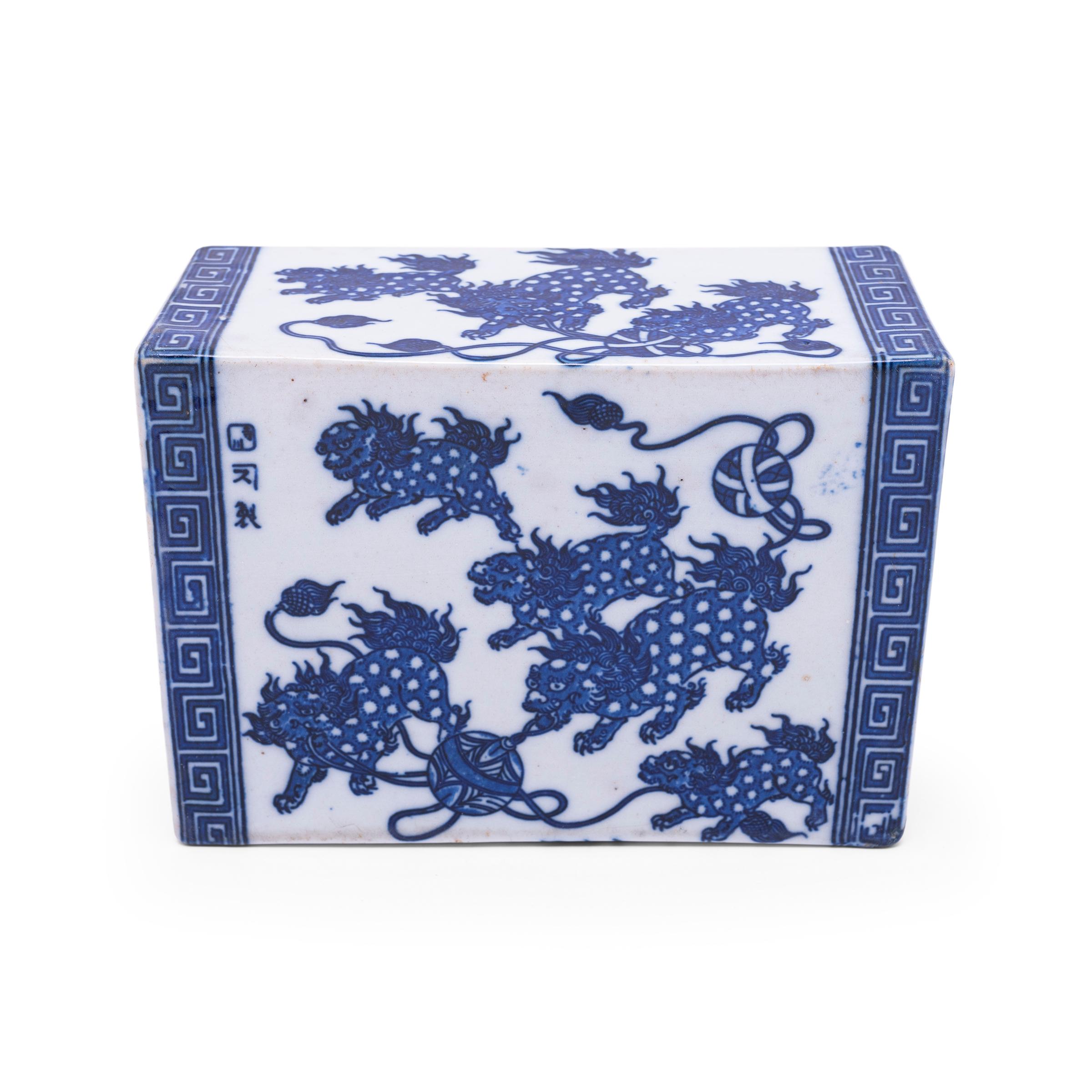 This rectangular ceramic block is actually a form of Chinese headrest or neck pillow. Popular during the Qing dynasty, rigid headrests such as this were used by upper-class women to protect their elaborate hairstyles by elevating the head during
