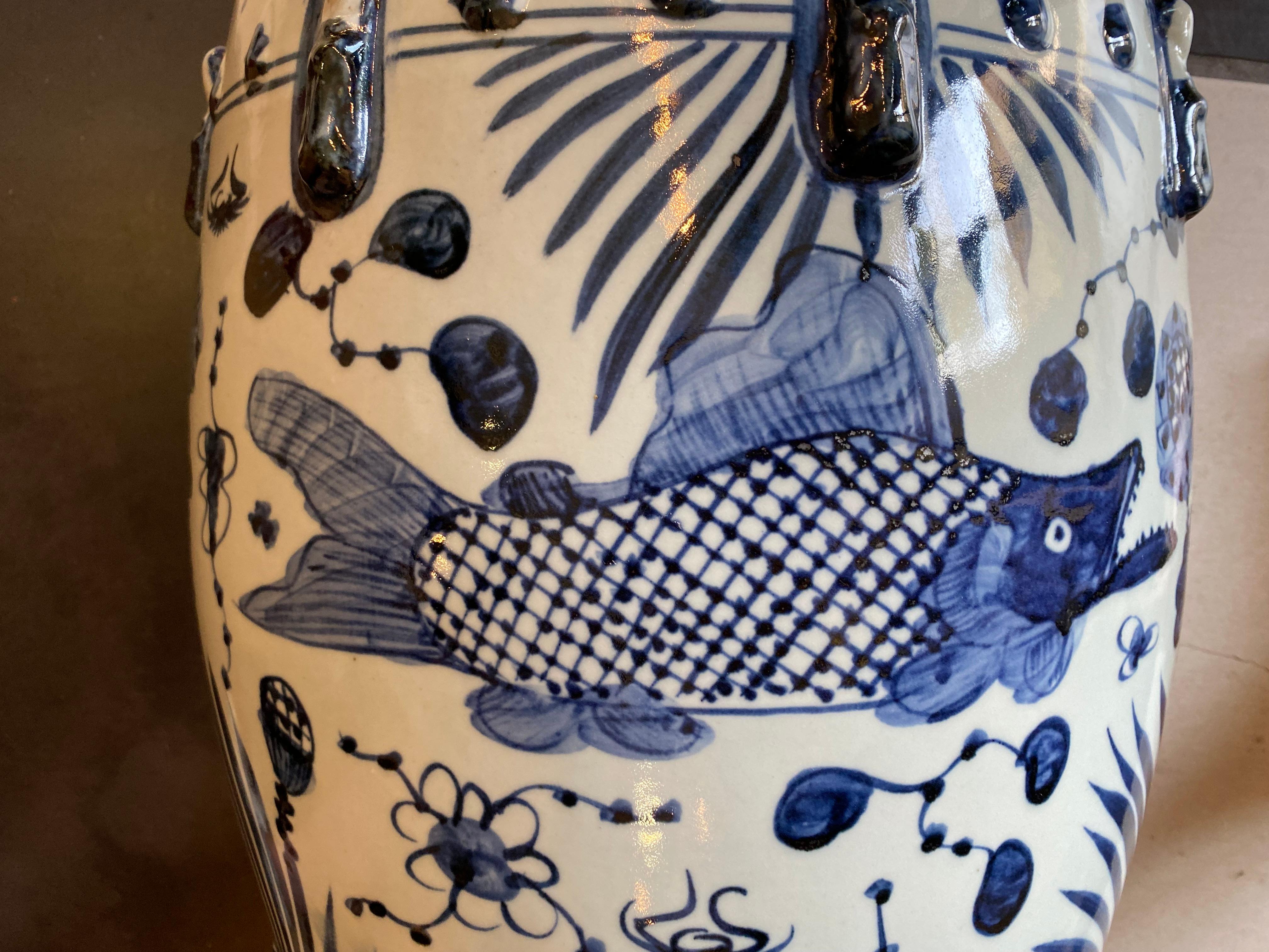 This whimsical Chinese Garden Stool is hand painted with fish and floral design.
It is 17.5