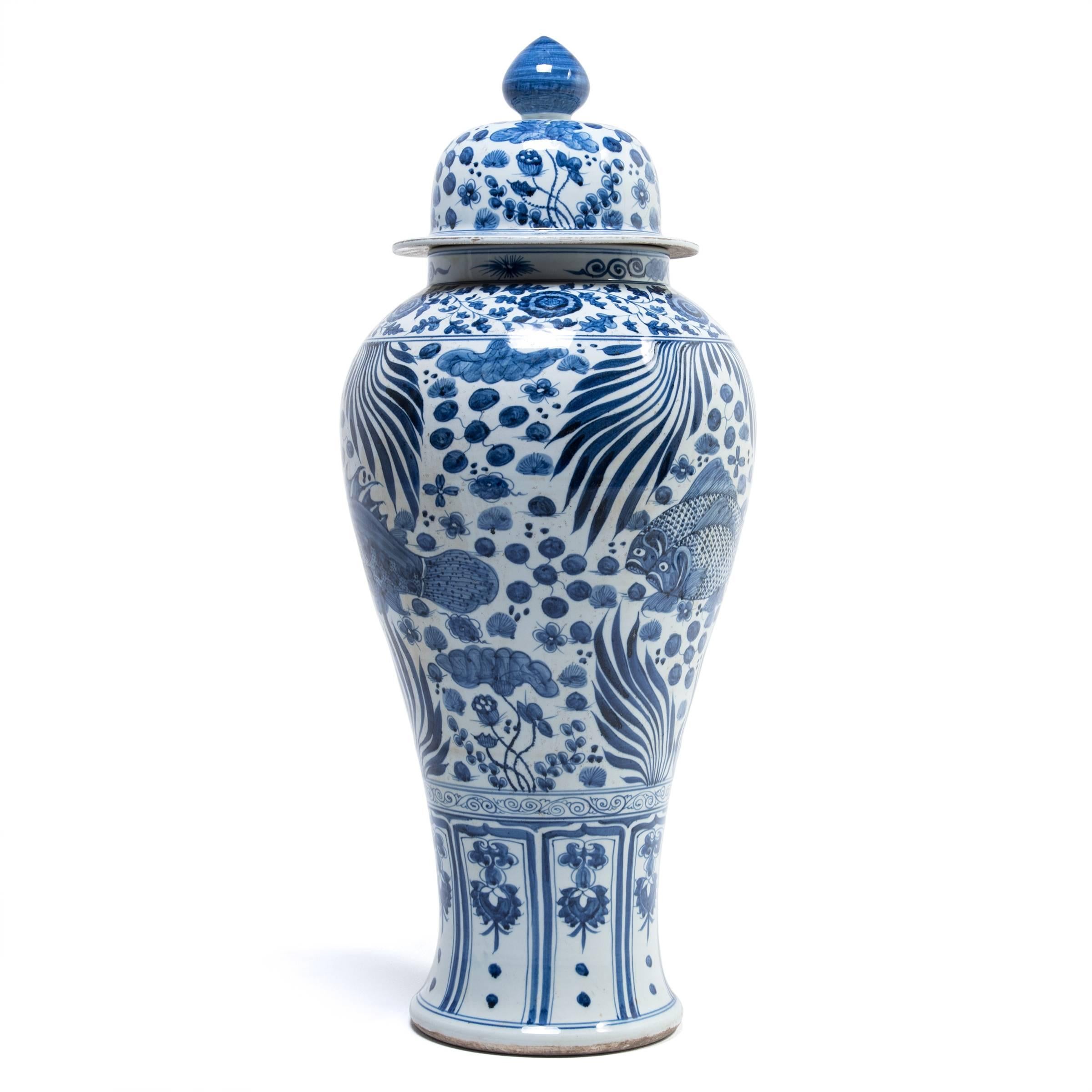 Revered for centuries for its elegant designs in rich cobalt blue on pure white, traditional Chinese blue-and-white porcelain lives on in this contemporary sea-inspired ginger jar. Intricately painted, the jar depicts a vibrant underwater world,