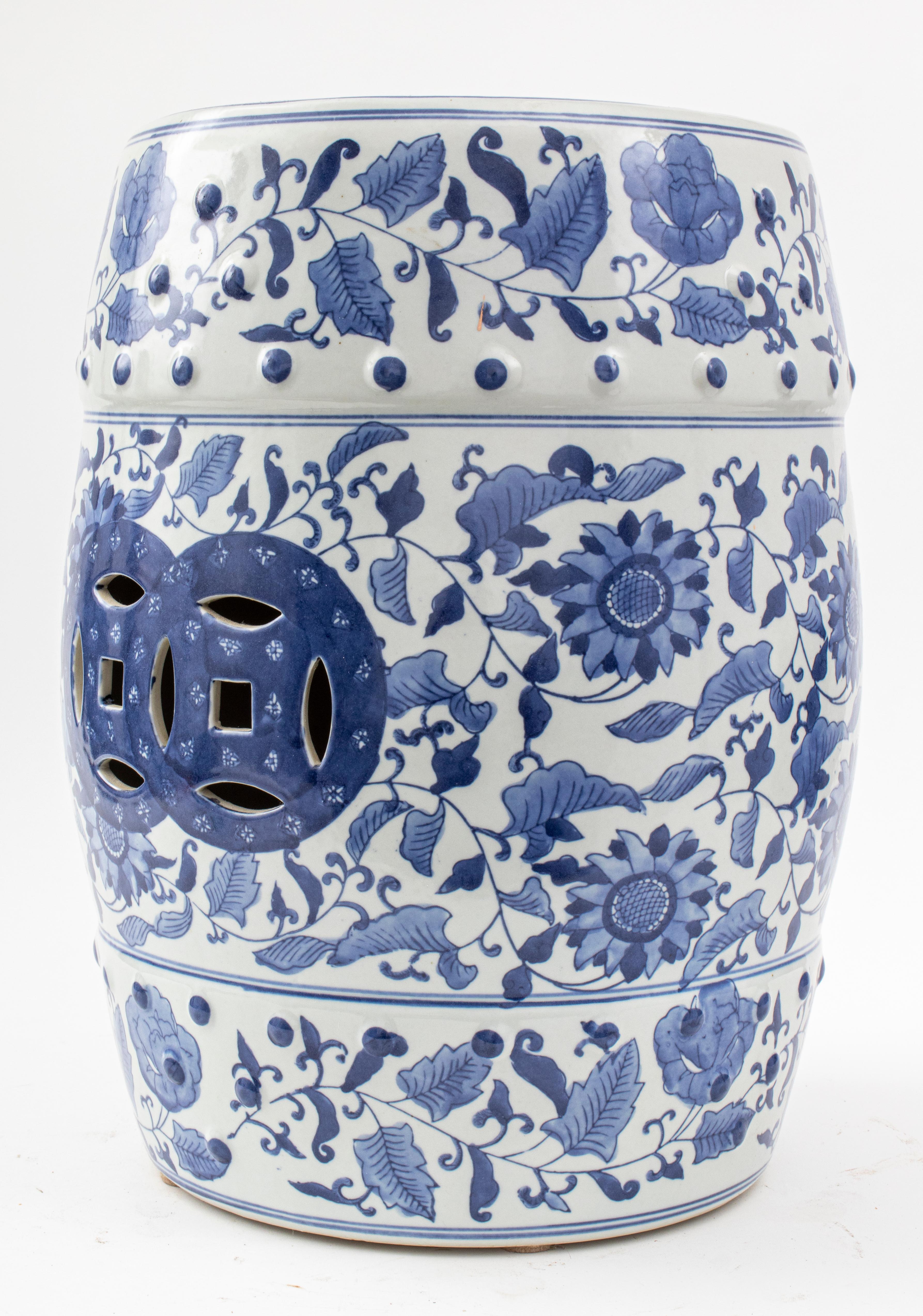 Chinese blue and white glazed ceramic pottery garden seat / stool decorated with scrolling foliate design and flowers. 

Measures: 18.5