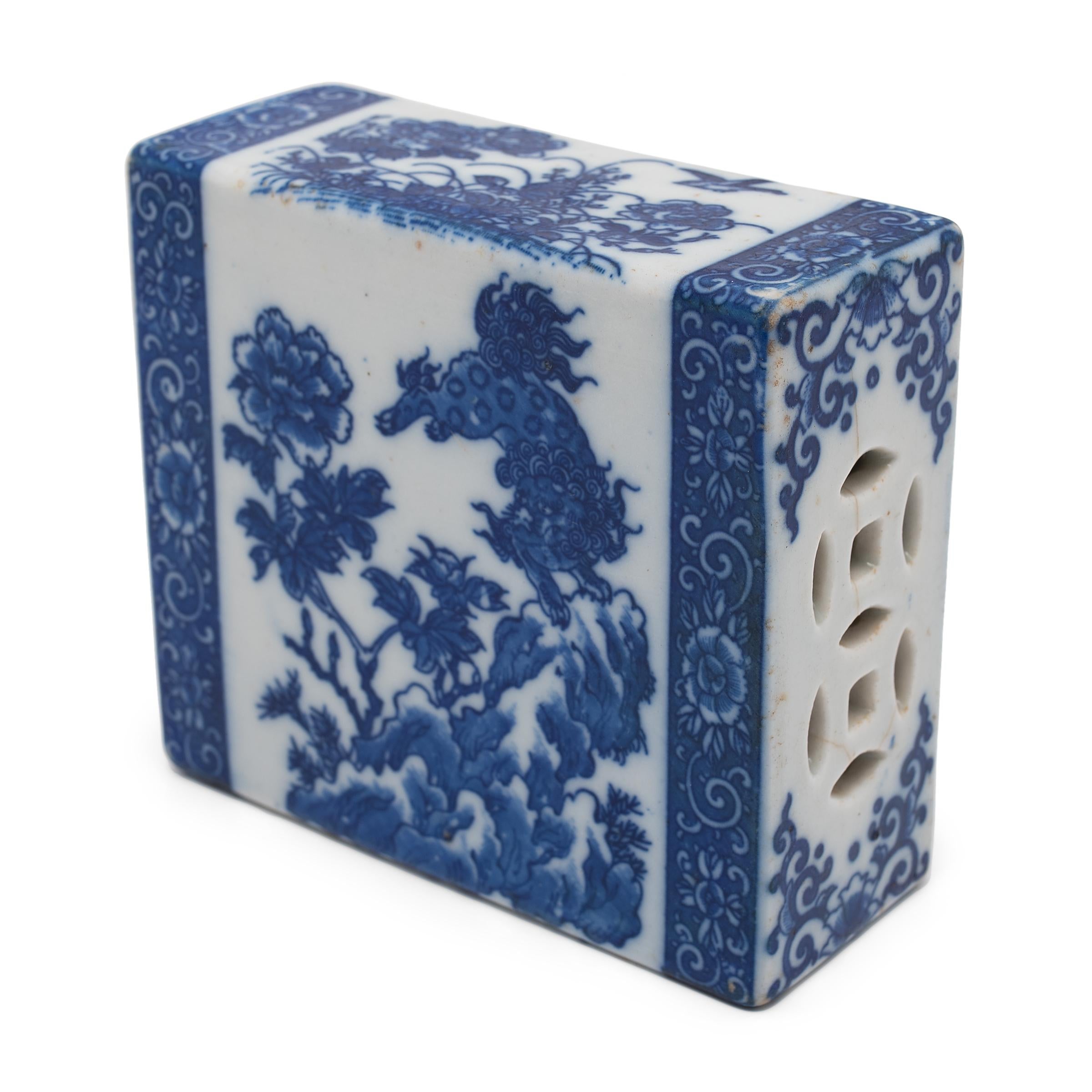 This small ceramic block is actually a form of Chinese headrest or neck pillow. Popular during the Qing dynasty, rigid headrests such as this were used by upper-class women to protect their elaborate hairstyles by elevating the head during slumber.