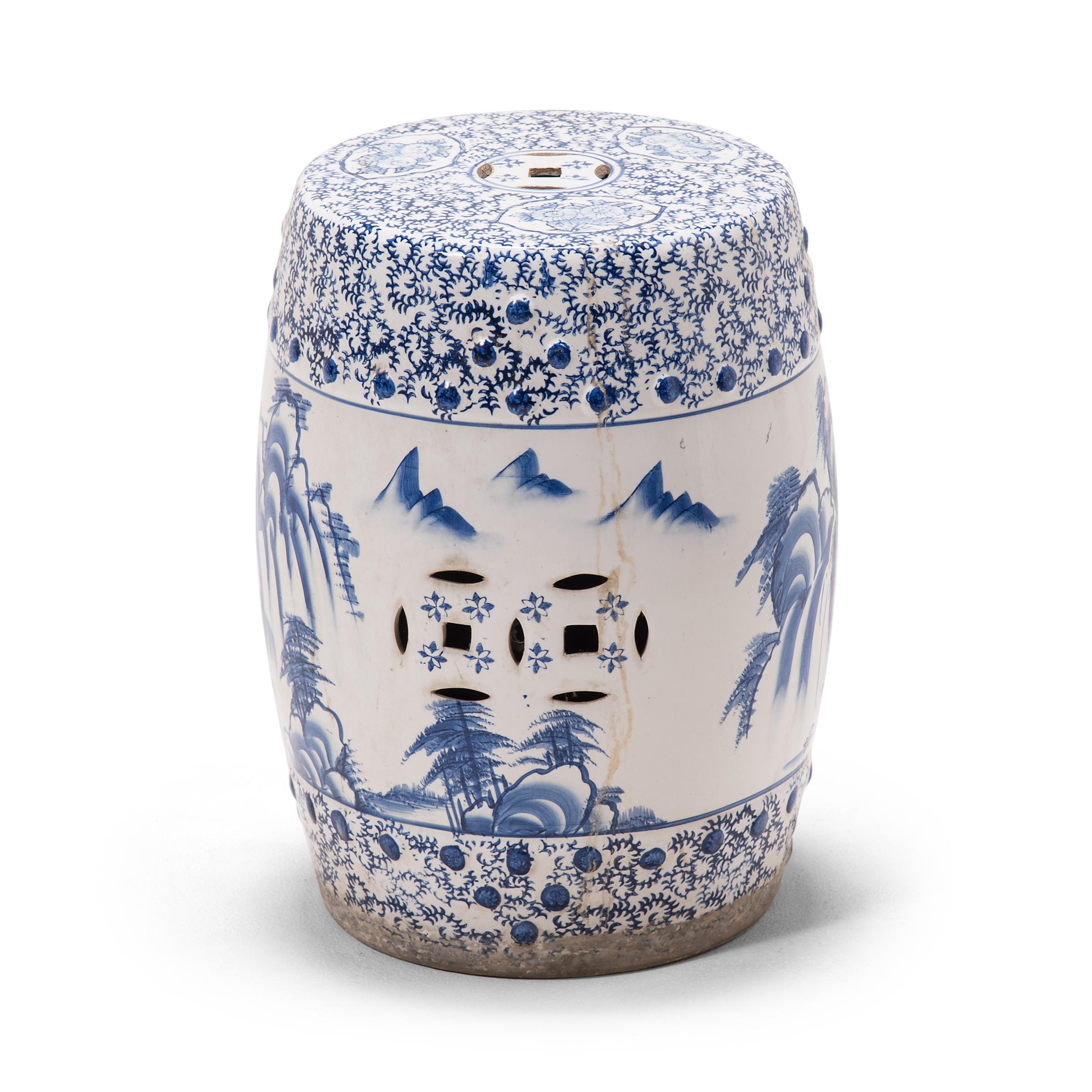 This beautiful ceramic garden stool is shaped in the traditional drum form and covered with intricate blue-and-white designs. The drum is adorned with a mountainous landscape scene, painted in the expressive style of traditional calligraphy
