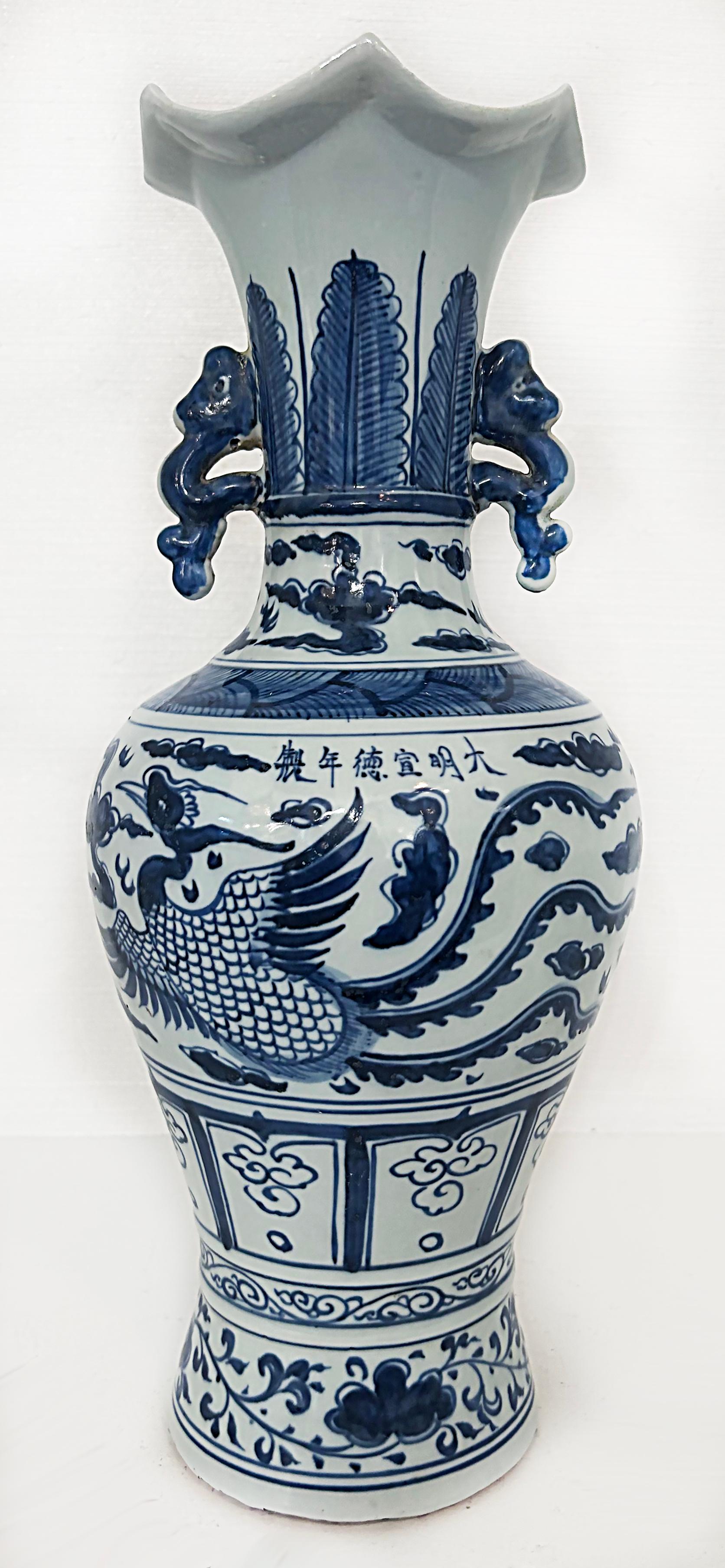 Chinese Blue and White Phoenix Bird Vases with Handles, Artist Signed 

Offered for sale is a fine pair of Chinese blue and white hand-painted, artist-signed two-handled vases depicting phoenix birds. This pair of tall vases are signed on the body