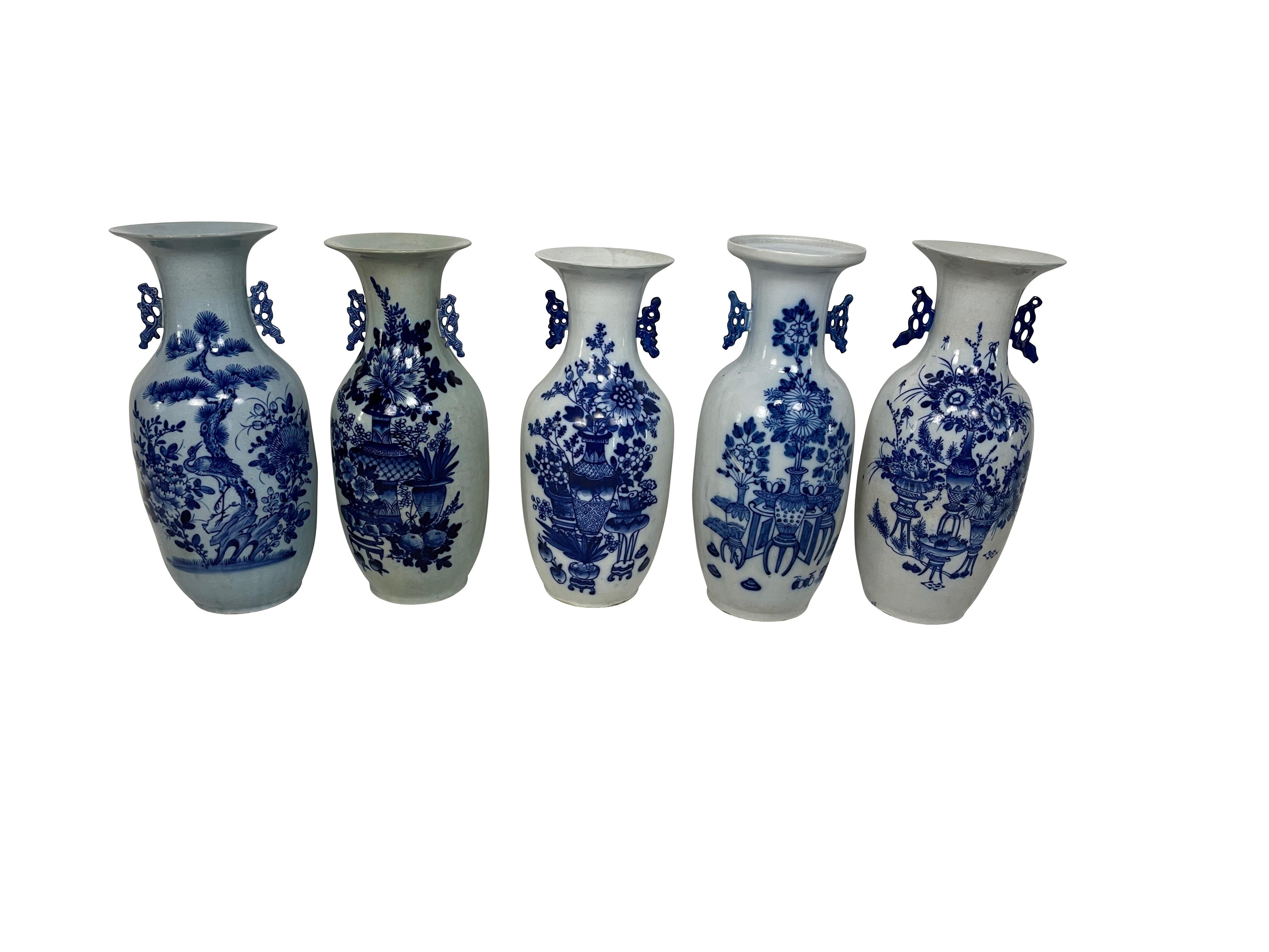 A collection of fine antique Chinese porcelain large baluster vases decorated with various flowers and objects in low relief and decorated in underglaze blue within a white glazed ground. The vase has molded stylized handles to either side of the