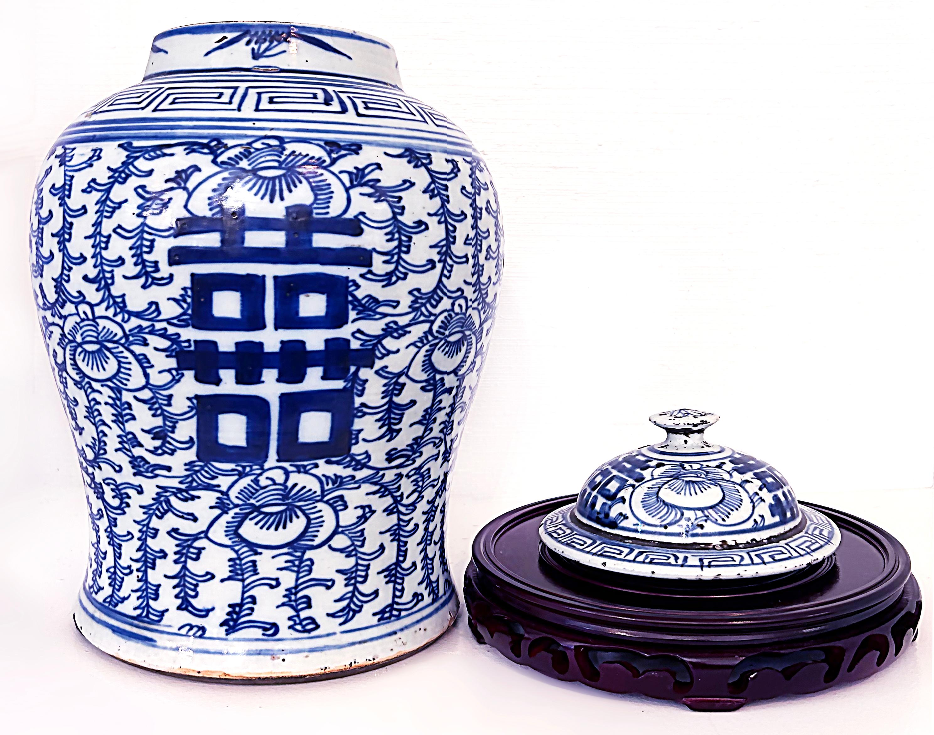 Chinese Blue & White Porcelain Covered Ginger Jar on Stand

Offered for sale is a Chinese blue and white porcelain ginger jar with a lid. The jar is presented on an ebonized carved wood base. The jar has Chinese figures glazed on the front and