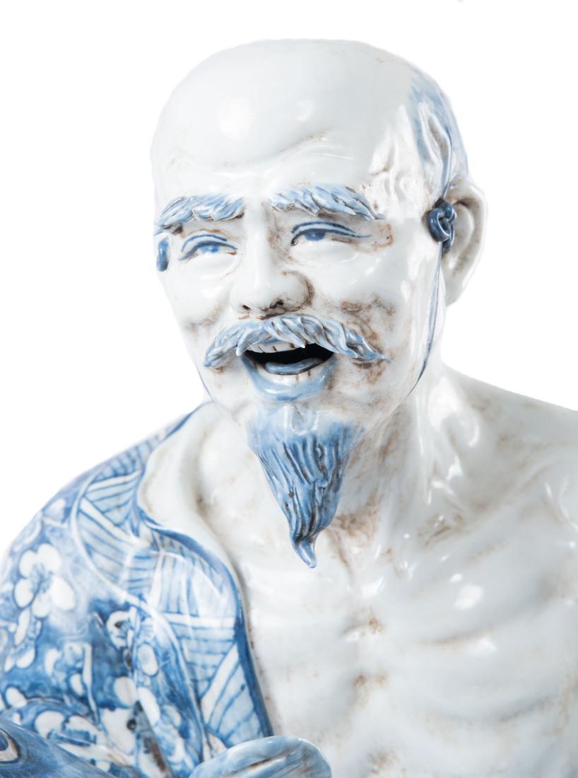 Chinese Export Chinese Blue and White Porcelain Figure of a Fisherman
