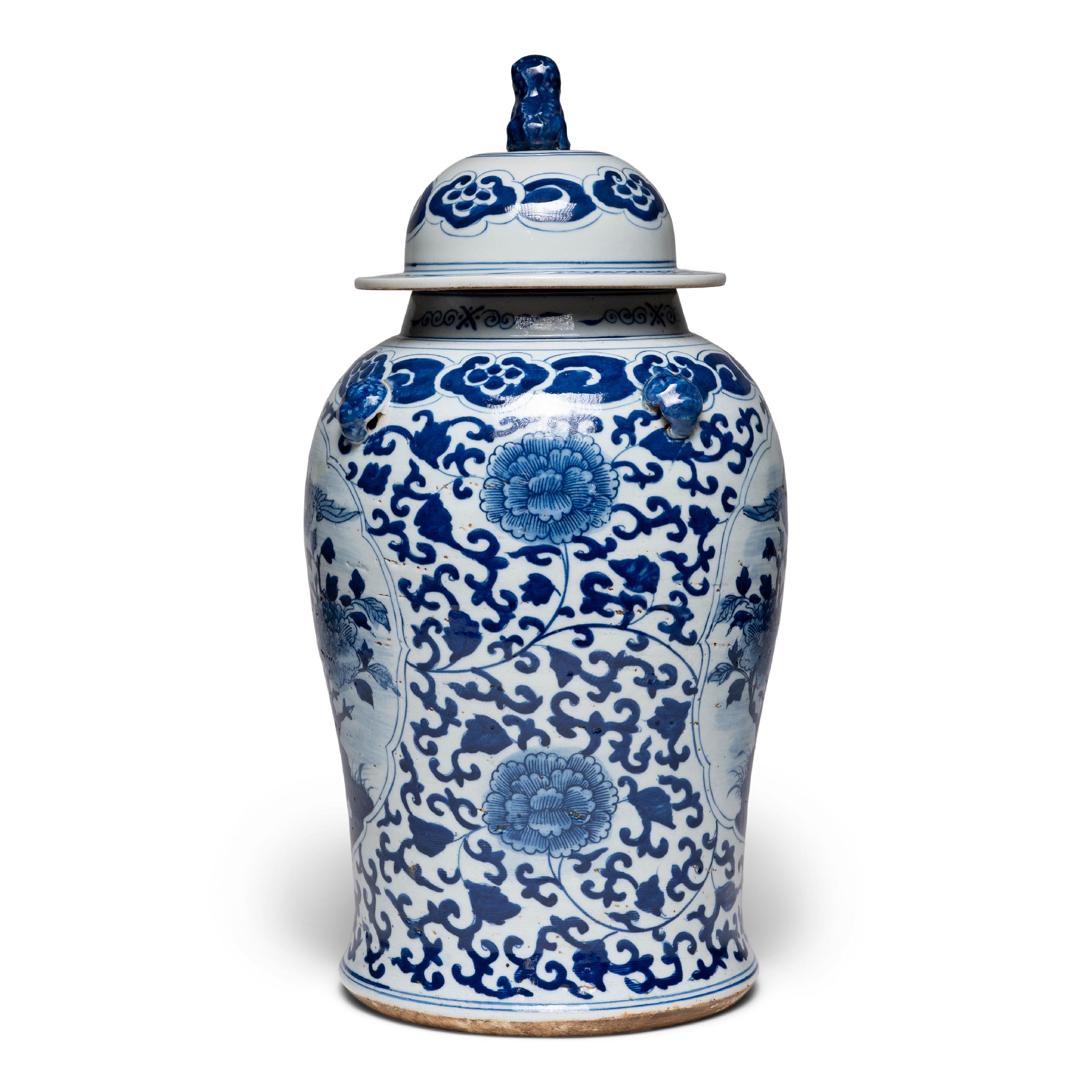This contemporary lidded baluster jar continues the centuries-old tradition of Chinese blue-and-white porcelain ware. Painted with cobalt pigments for a brilliant blue finish, the jar is densely patterned with trailing vine scrollwork and peony