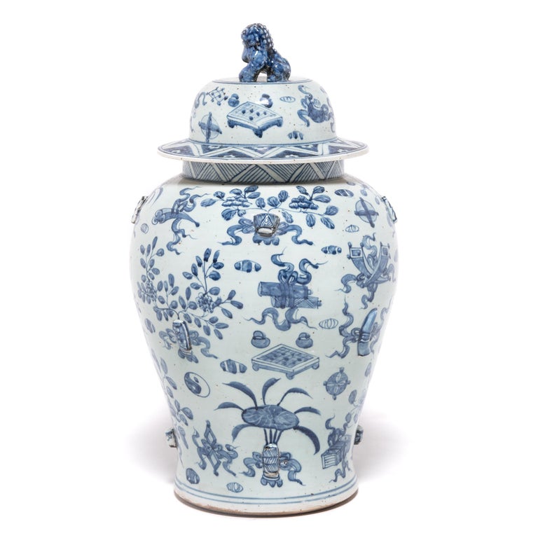 This contemporary ginger jar continues the tradition of Chinese blue-and-white ceramics with Classic curves and auspicious, hand painted decorations. Symbols that would surely give a Chinese scholar joy - yin yang, double-luck coins, and painted