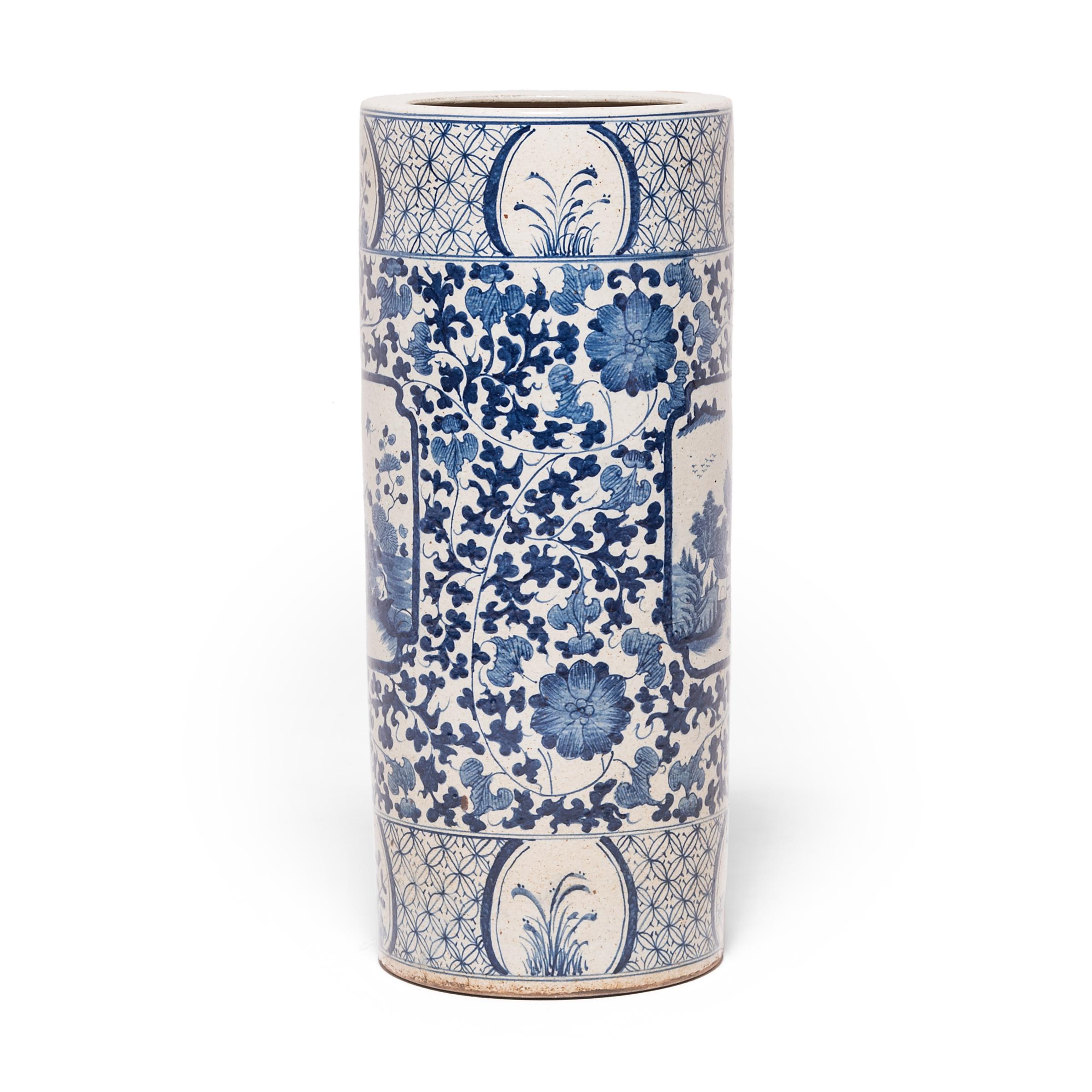This contemporary Chinese blue and white vessel was hand-painted with birds, flowers, trailing vines in a brilliant cobalt blue glaze against a creamy white background. One side of the vessel bears a traditional landscape painting, known as a 