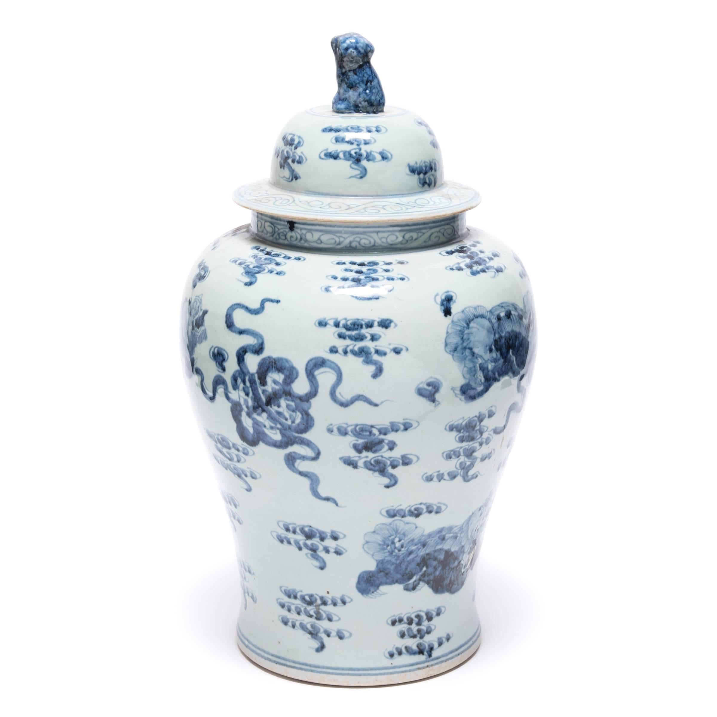 Images of shizi, a lion-dog symbol of power and strength of character, cavort among the stylized clouds of heaven on this hand-painted covered jar. Originally intended for storing spices, this jar is a beautiful example of traditional Chinese