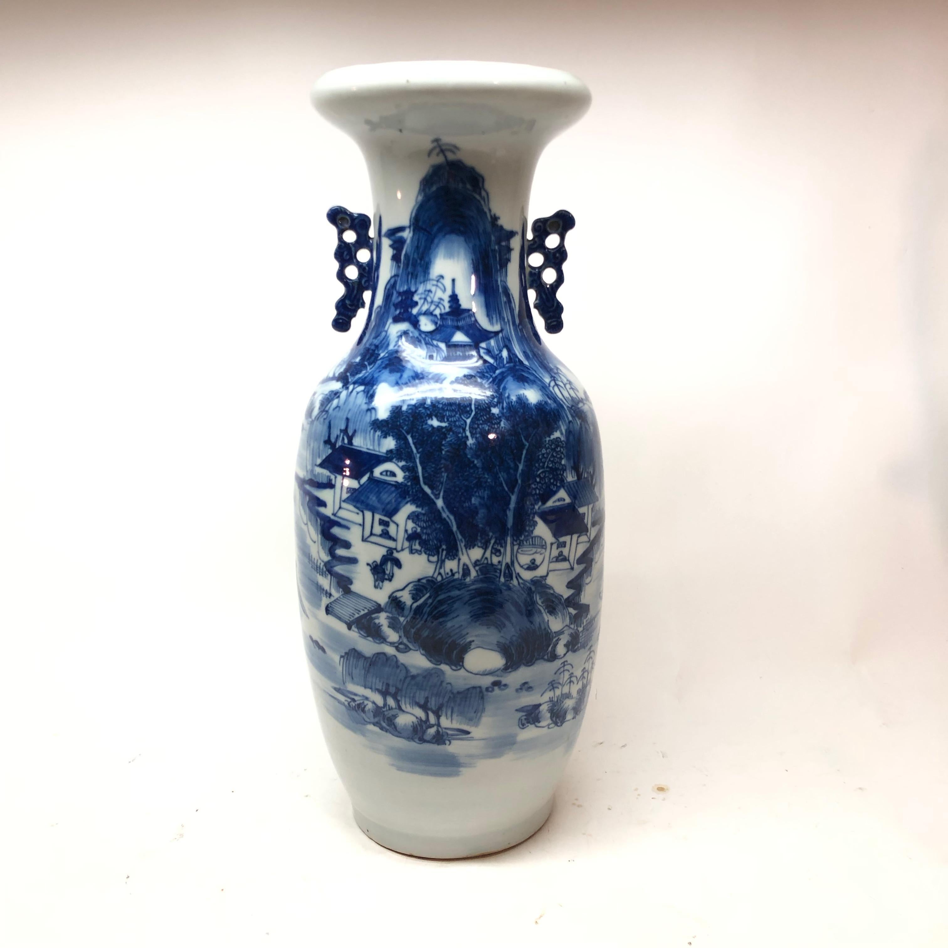 Tall Chinese blue and off-white vase.