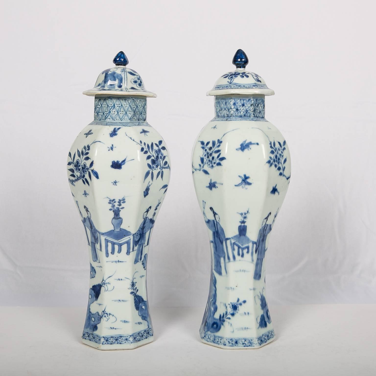 This pair of Blue and White vases painted in the Kangxi era some three hundred years ago are elegantly decorated with slim ladies enjoying their pastime in picturesque private gardens. In the foreground we see jagged Taihu rocks upon which grow